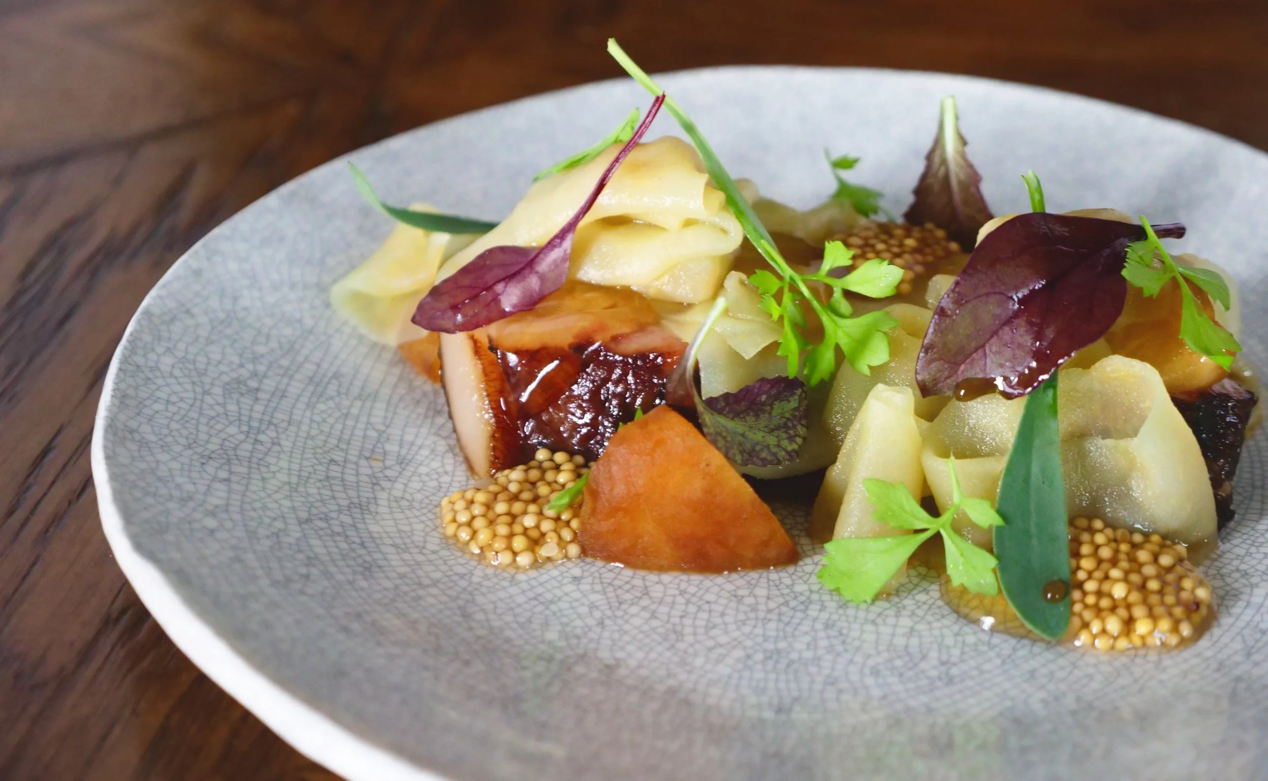 HICKORY SMOKED PORK JOWL, APPLE RIBBONS, CHARRED GALA APPLE, PICKLED MUSTARD, HONEY GEL & HERBS.