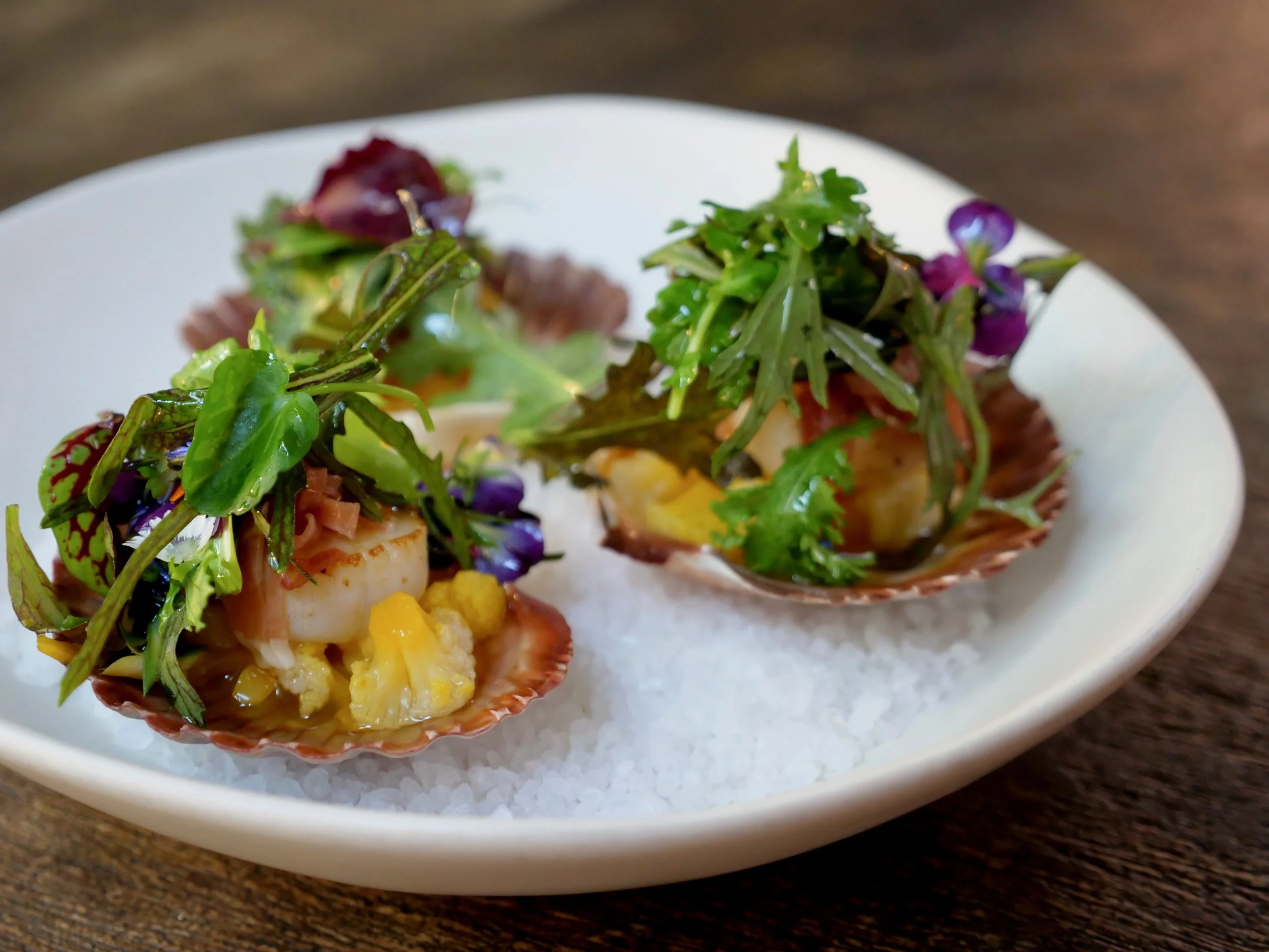 HERVEY BAY SCALLOPS, CAULIFLOWER ESCABECHE AND PETITE SEASONAL MIX.