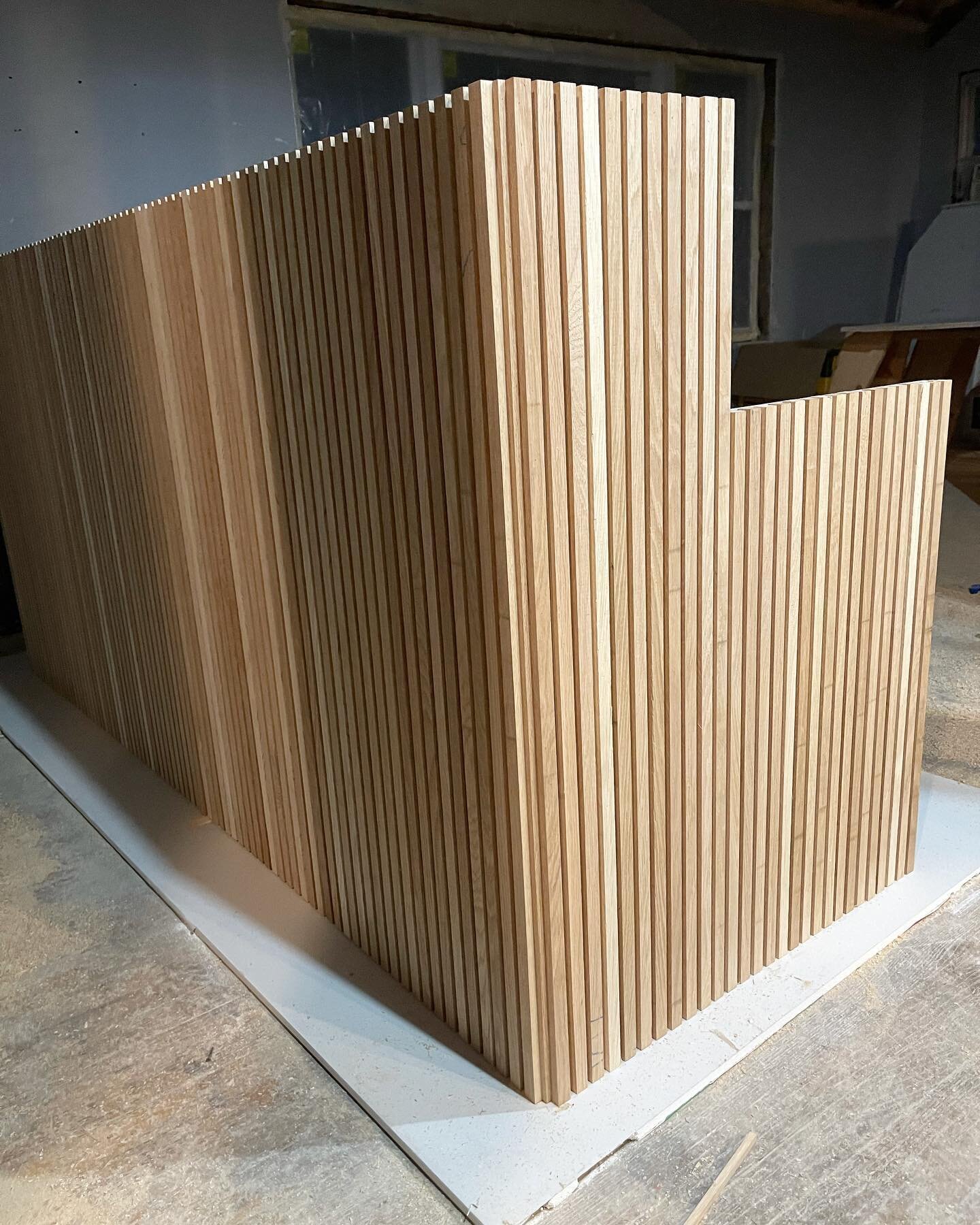 Custom reception desk designed for the @ride_zoomo Chicago shop ❤️&zwj;🔥 I just got this progress shot from the carpentry team and WOW. It&rsquo;s shaping up to be a favorite piece I&rsquo;ve designed to date! #rsimonstudio #interiordesignchicago #f
