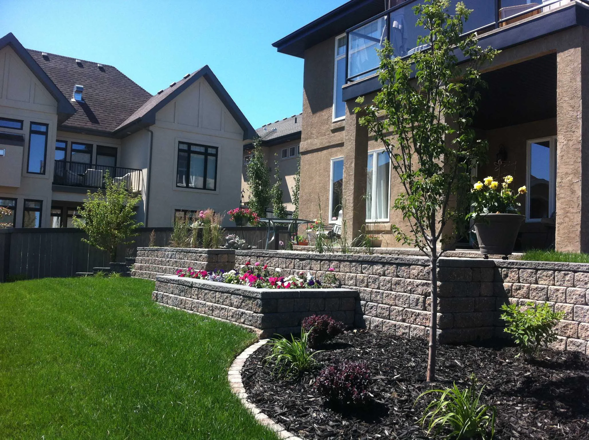 Edmonton multi tiered retaining wall with built in stairs