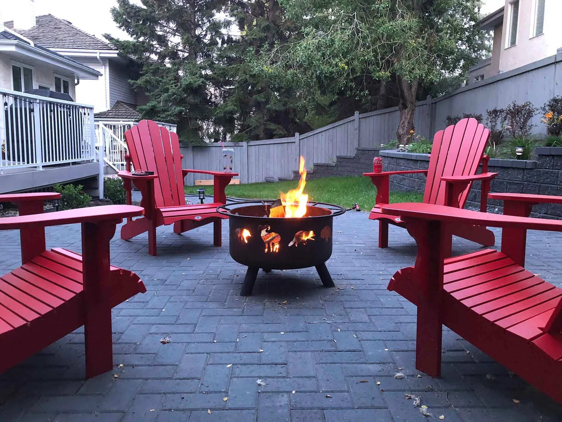 Beautiful fire pit seating area in backyard riverbend edmonton home