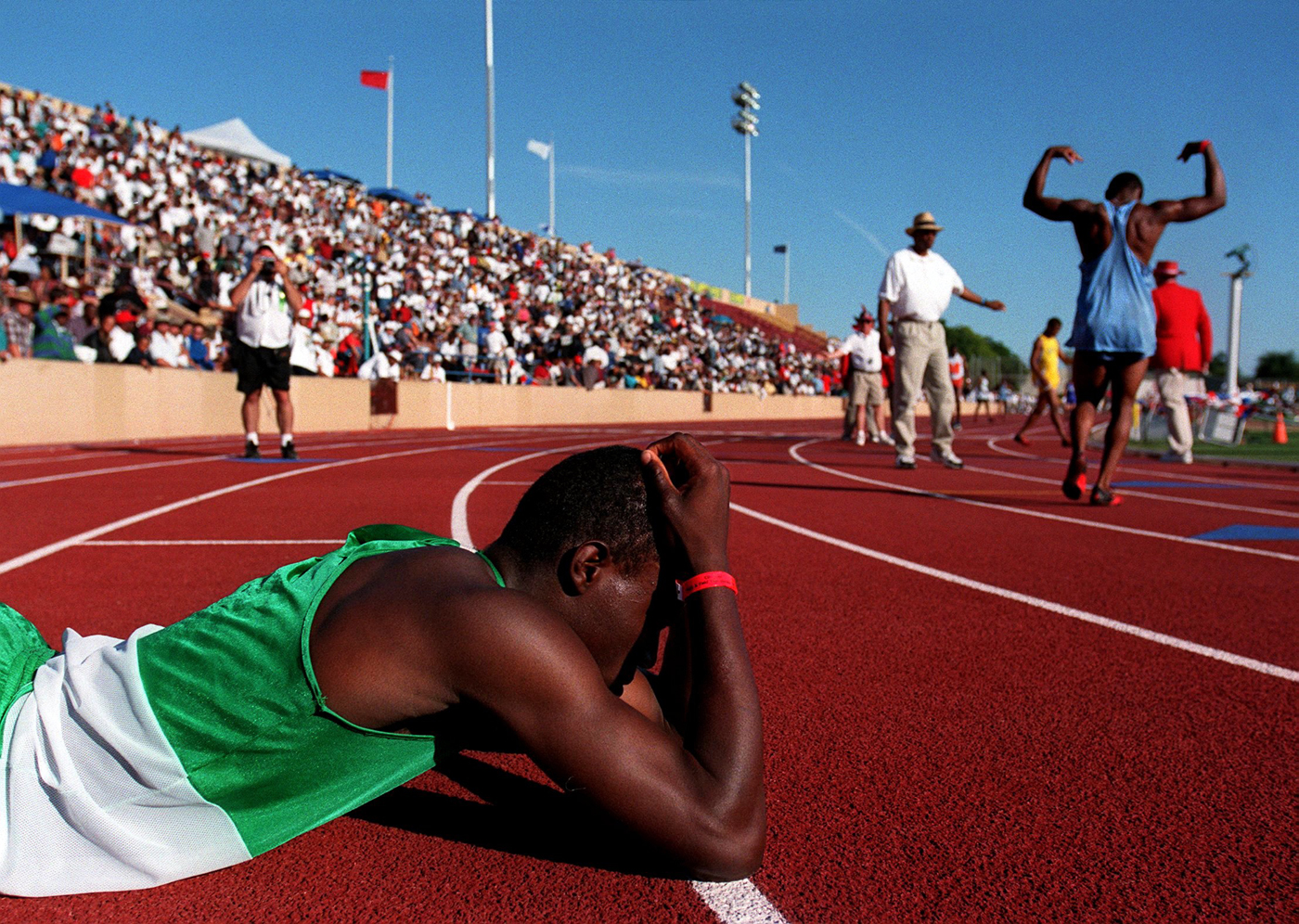  Jason Rudison of Dorsey High School in Los Angeles gathers himself after loosing in the Mens 4 x100 meter race during the CIF State Track and Field Track Championships in Sacramento. 