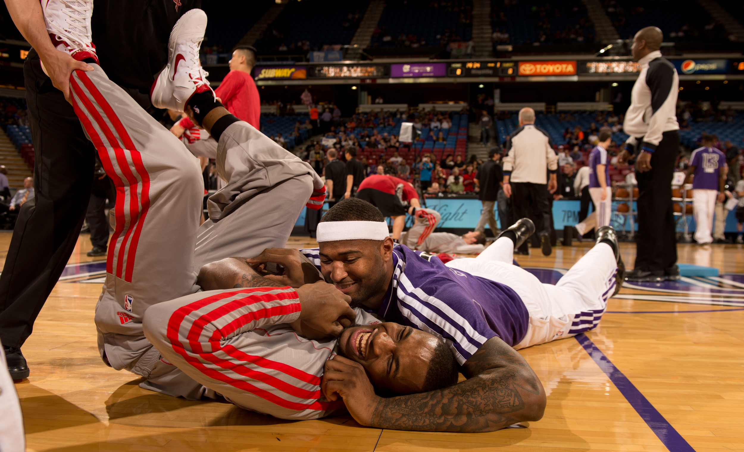  Sacramento Kings DeMarcus Cousins embraces former teammate Thomas Robinson of the Houston Rockets during pregame warmups prior to the NBA game in Sacramento. 