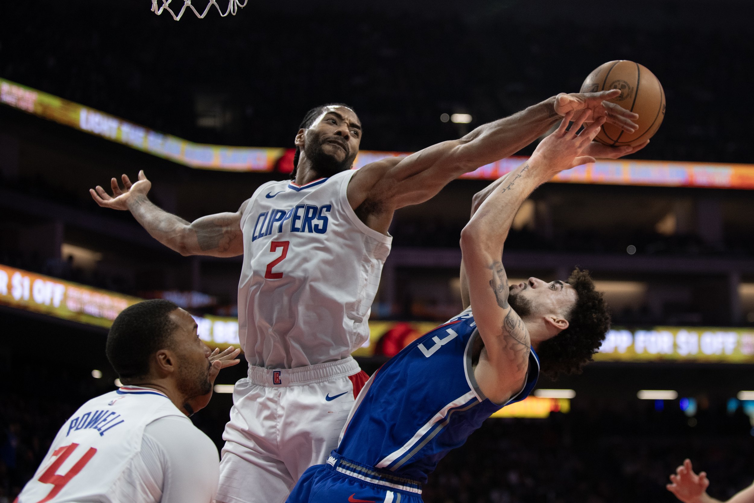  Sacramento Kings guard Chris Duarte (3) is fouled by Los Angeles Clippers forward Kawhi Leonard (2) as he shoots in the first quarter in an NBA basketball game in Sacramento, California. 