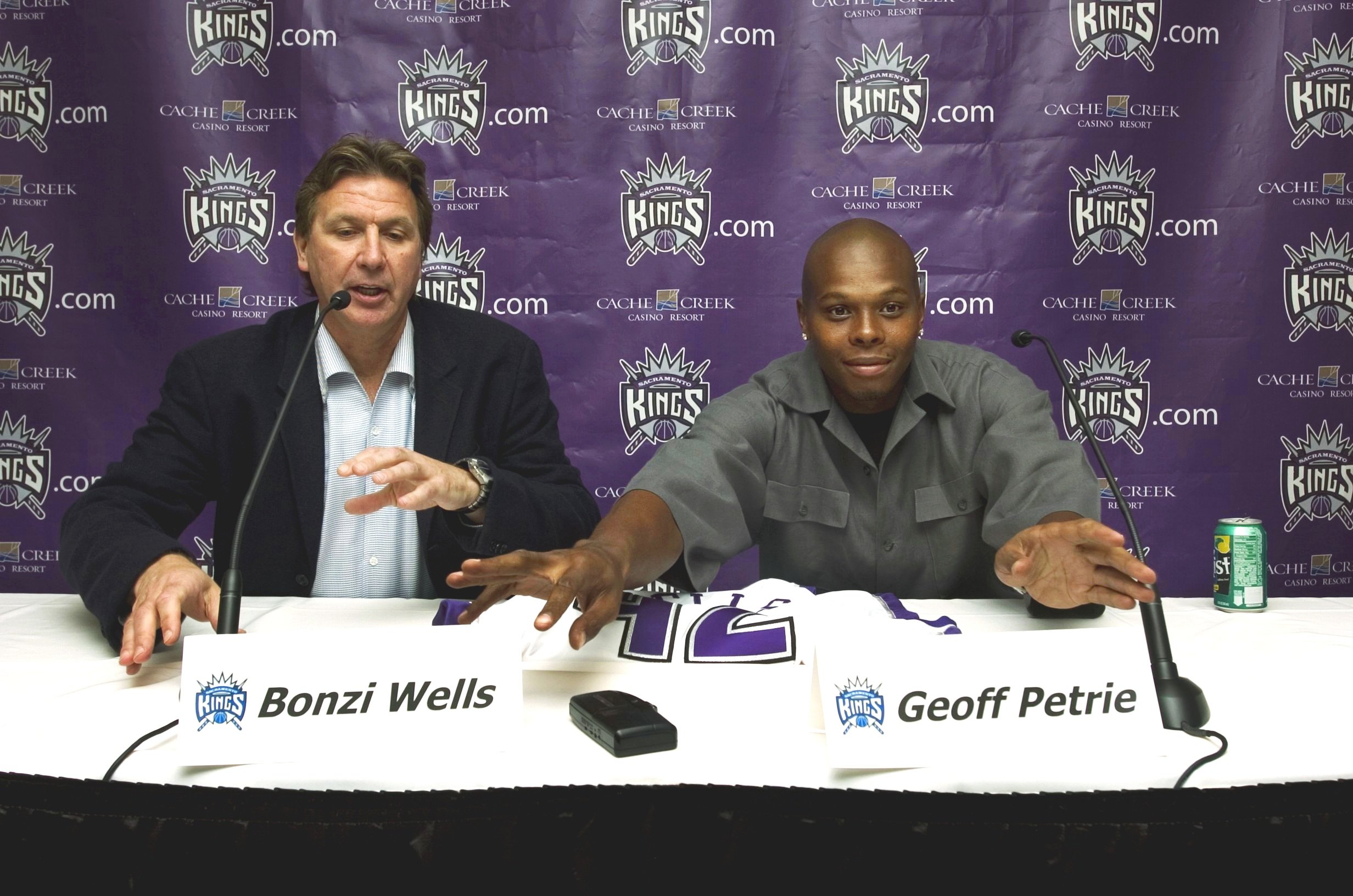  Sacramento Kings guard Bonzi Wells (right) is introduced to the local media with Kings President Geoff Petrie on Thursday afternoon at the Sacramento Kings practice facility in Sacramento, California. 