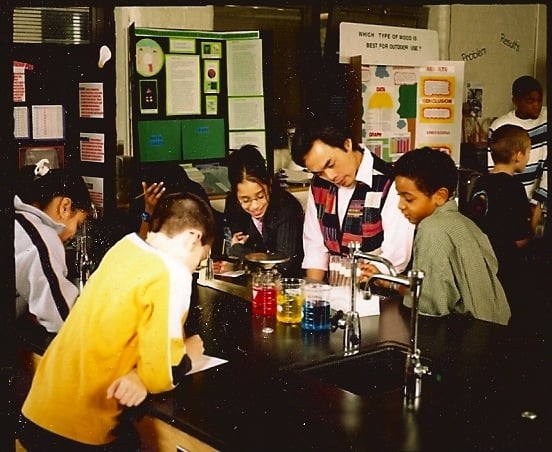 Huân and students in the Science Lab