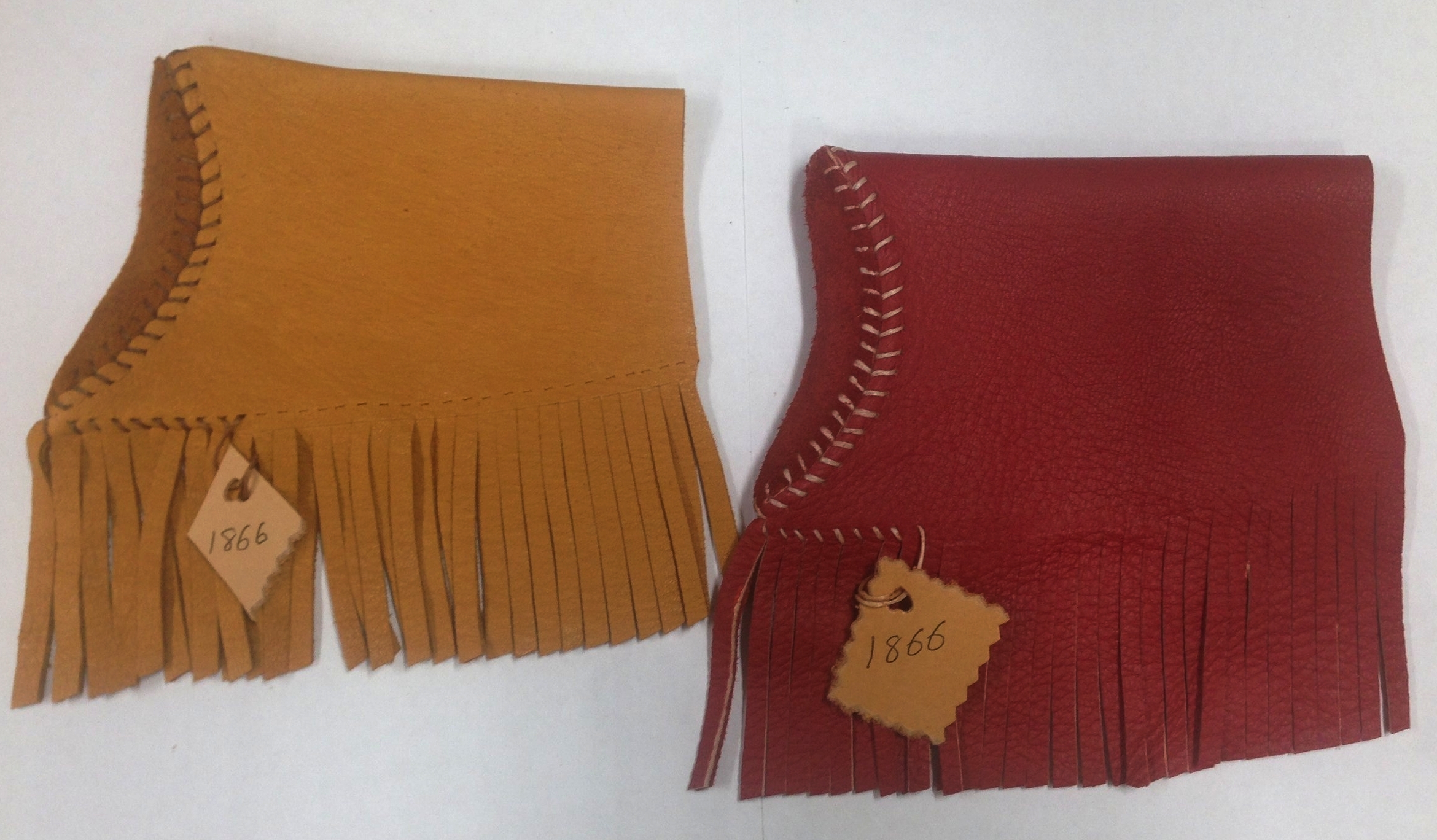 Shown here are the limited light tan and red 1866 fringe covers.