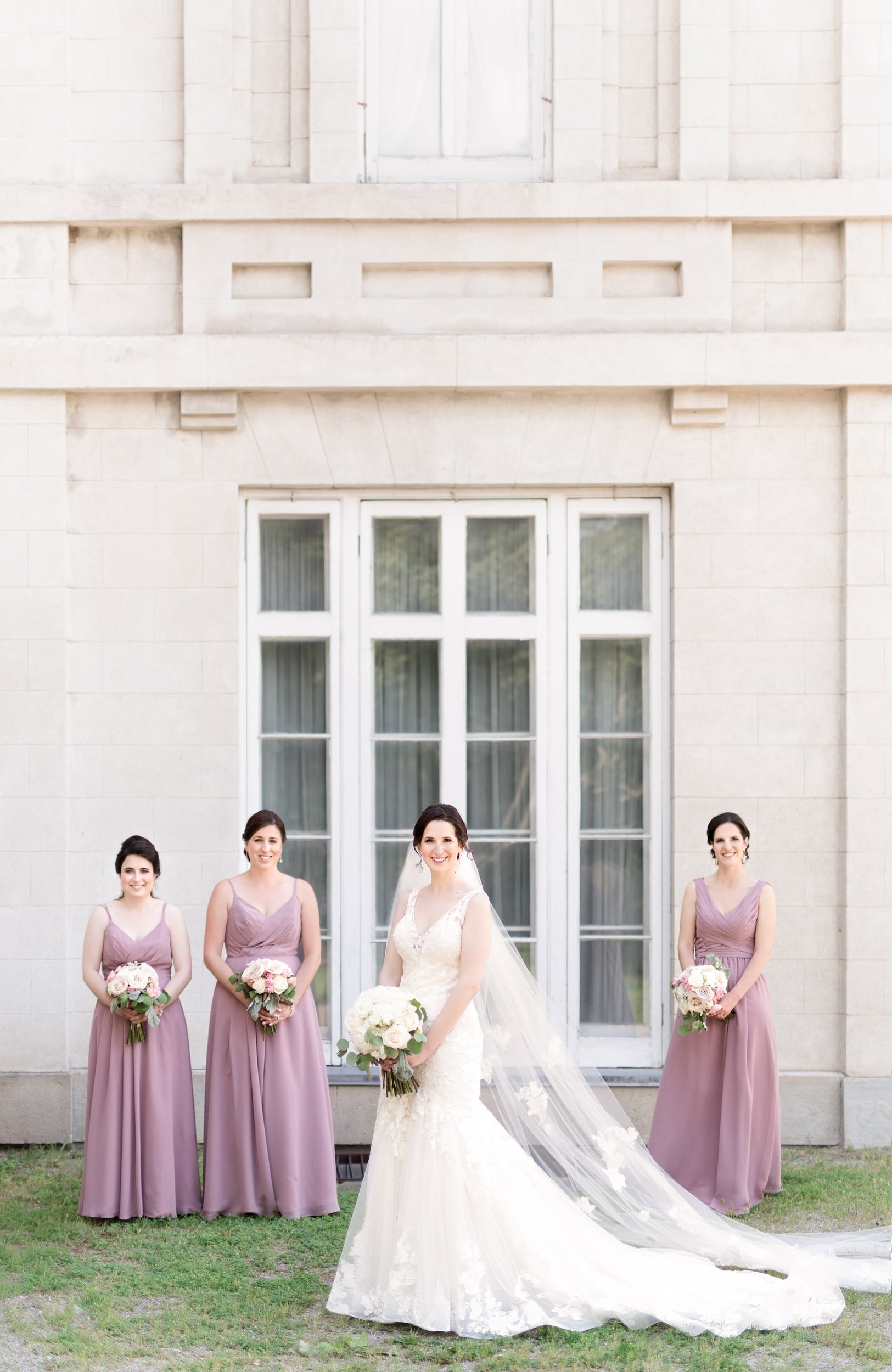 Bridesmaids portrait against Dundurn Castle white exterior