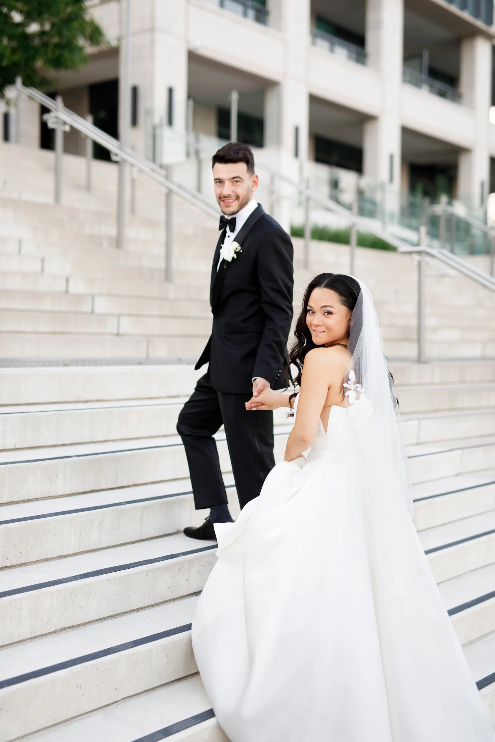 Bride and groom on modern terrace steps at The Pearle Hotel & Spa in Burlington, Ontario