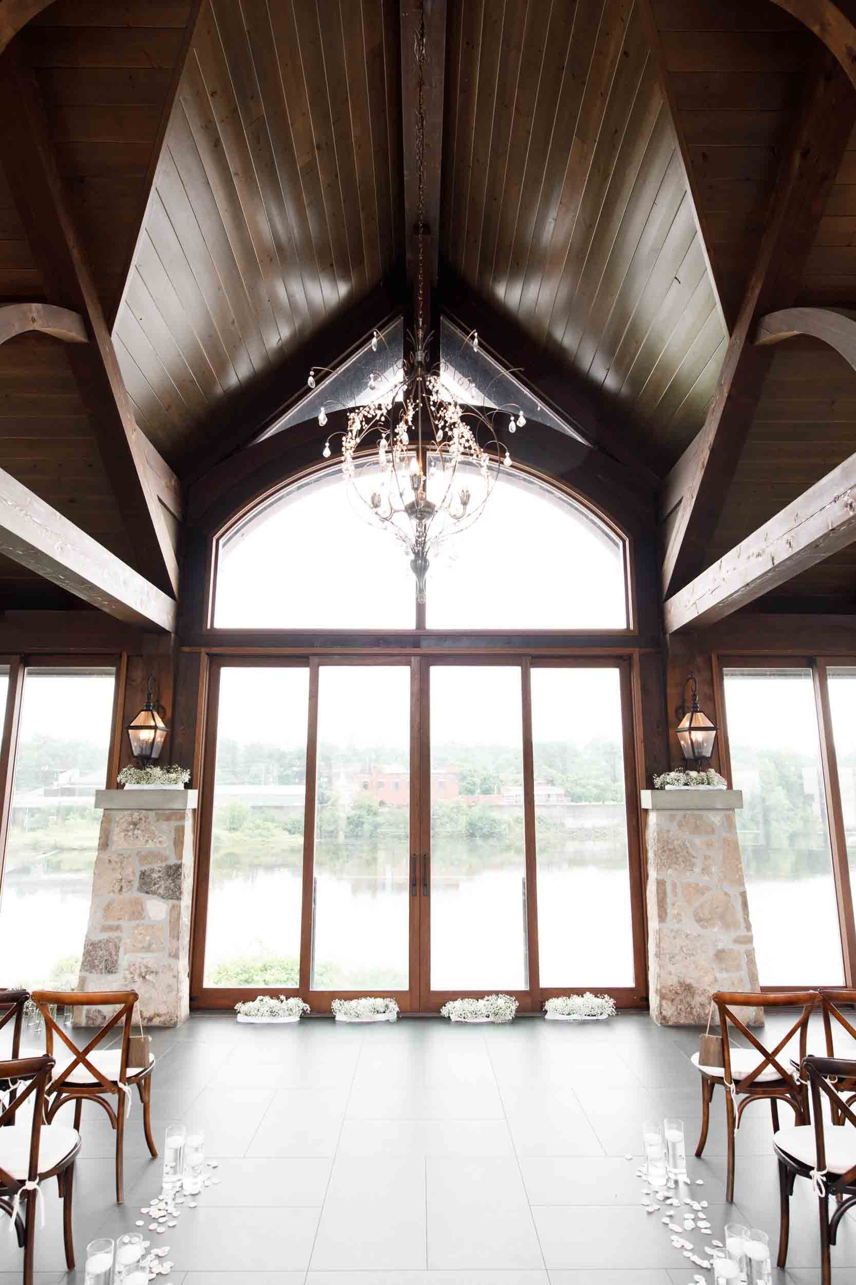 Grand River pavilion ceremony backdrop inside Cambridge Mill wedding venue