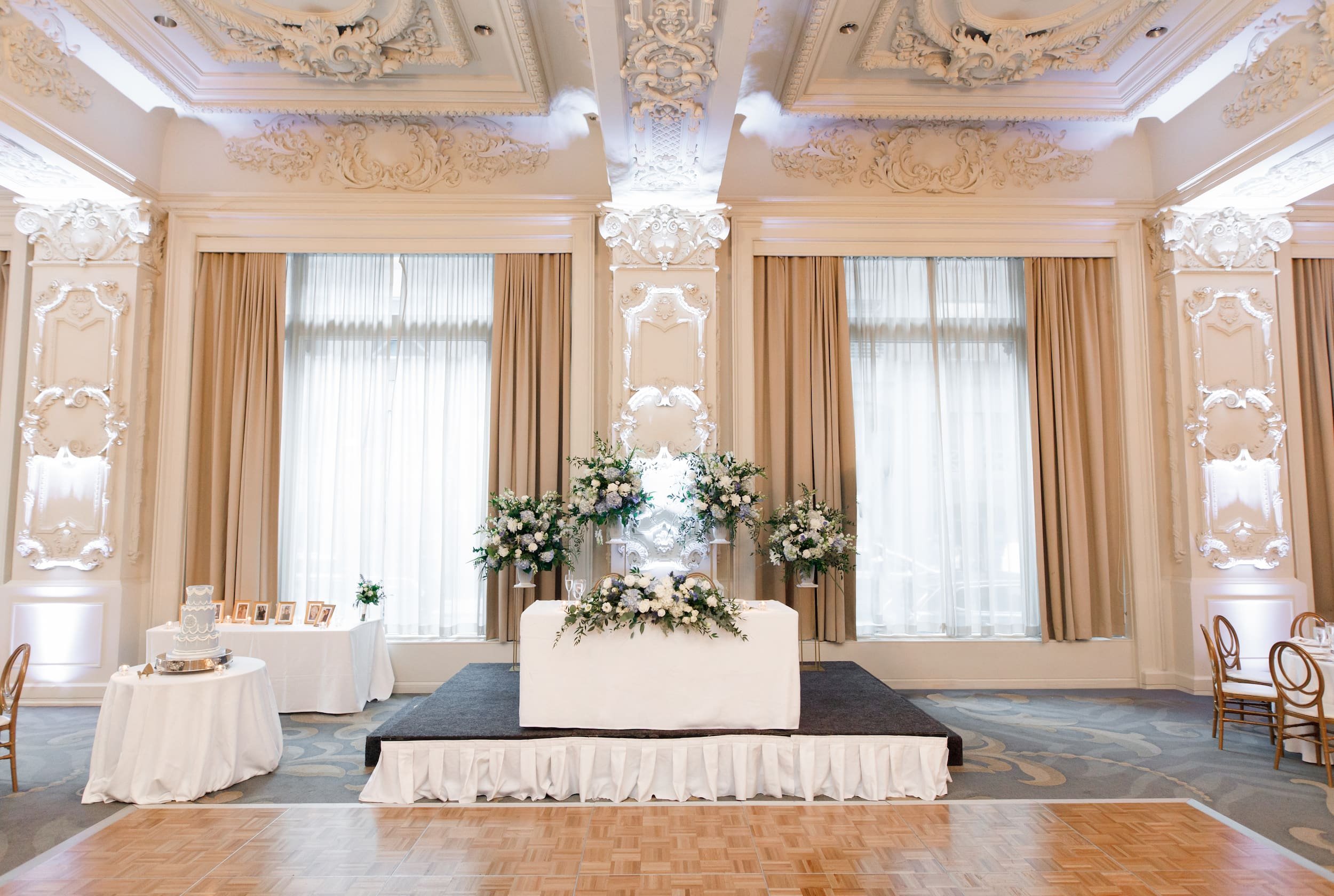 Head table stage inside the Sovereign Ballroom at Omni King Edward Hotel