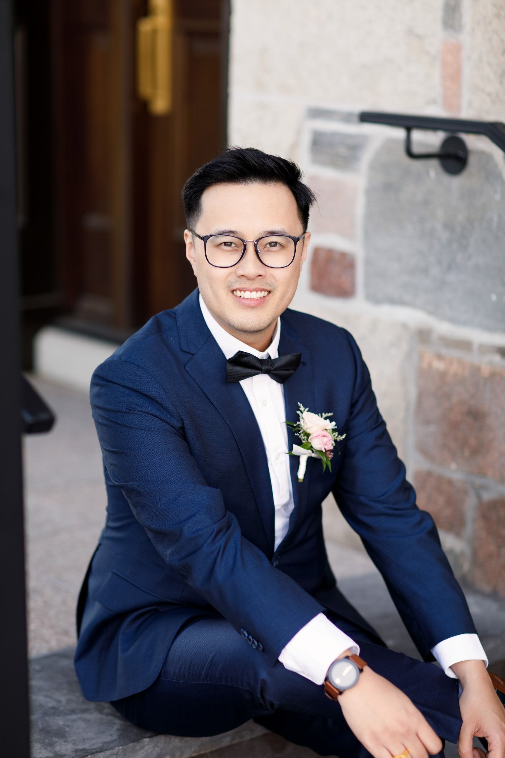 Groom seated for a wedding portrait at The Arlington Estate in Vaughan, Ontario