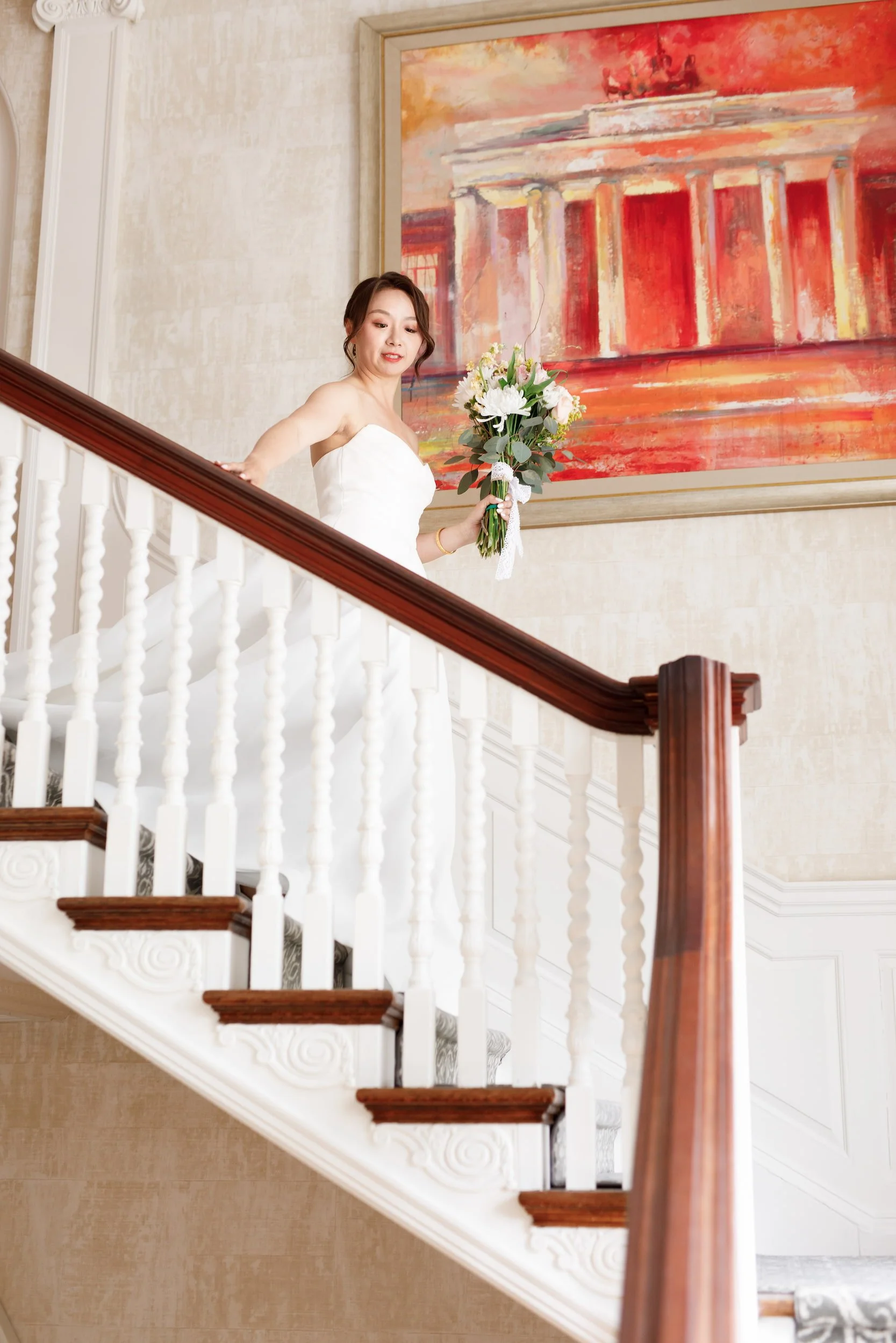 Bridal portrait on grand staircase at Graydon Hall Manor