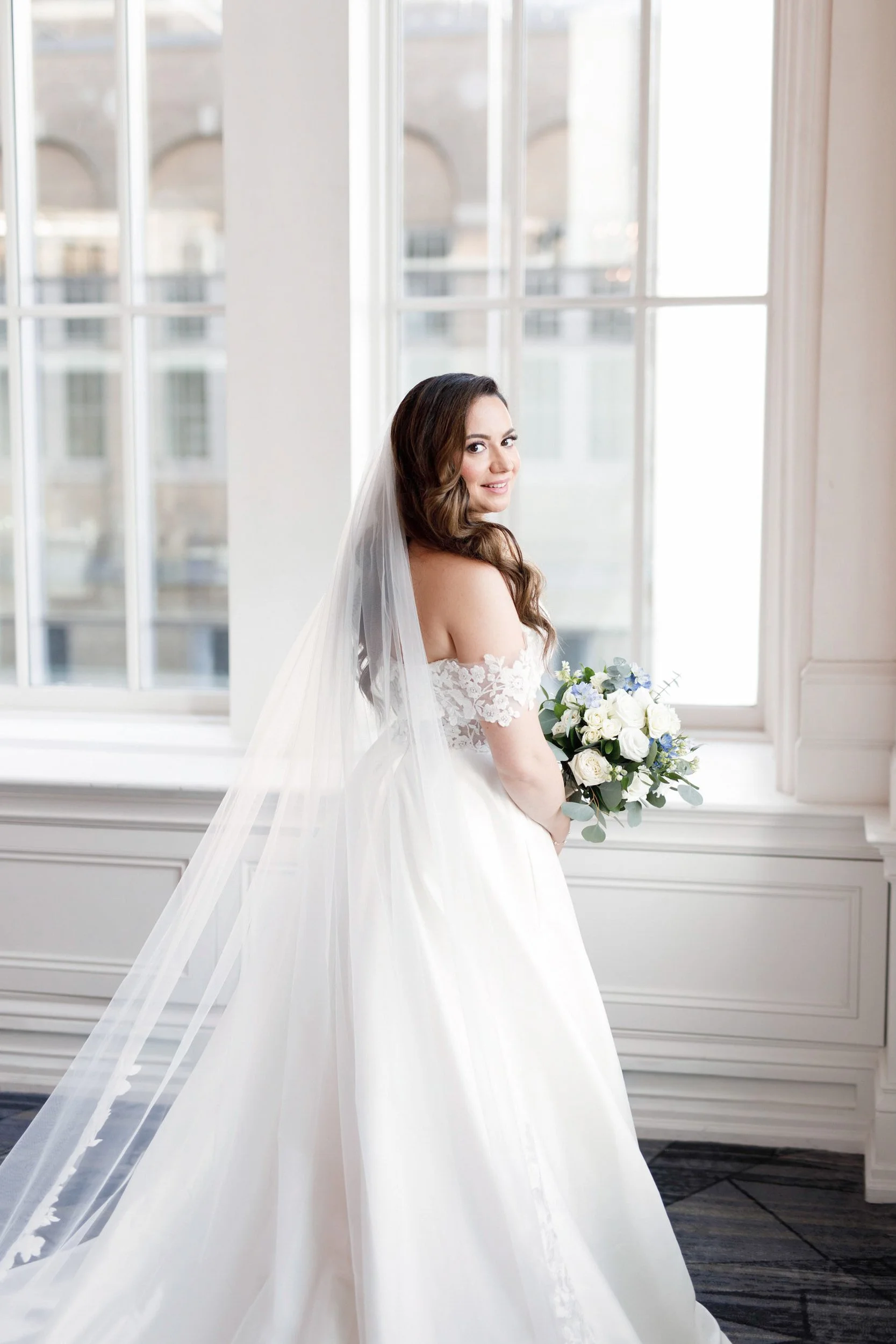 Crystal Ball Room bridal portrait by grand windows at Omni King Edward Hotel in downtown Toronto