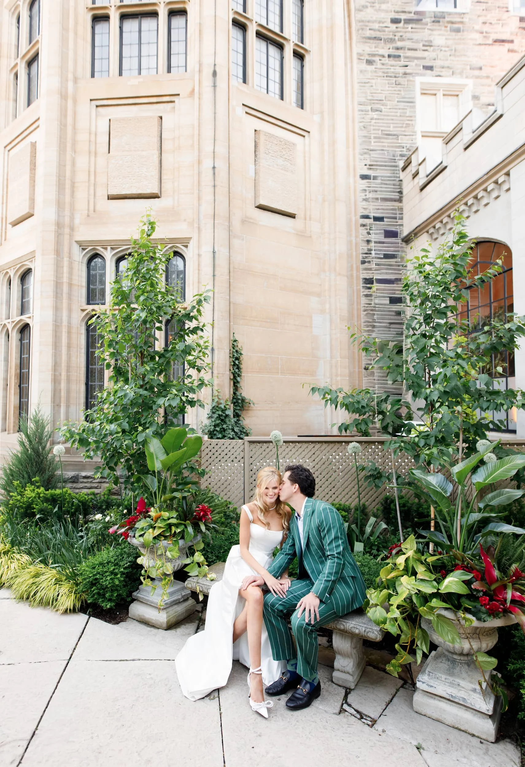 Couple portrait beside Casa Loma Gothic stone archways
