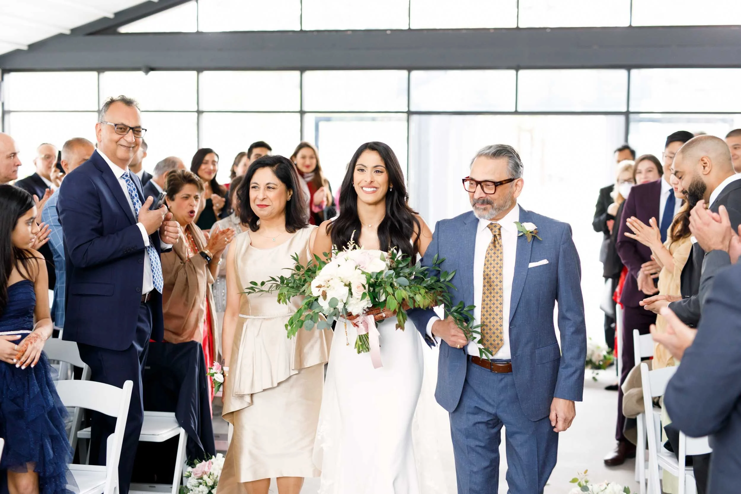 Wedding ceremony inside the white canopy pavilion at Whistle Bear Golf Club in Cambridge, Ontario