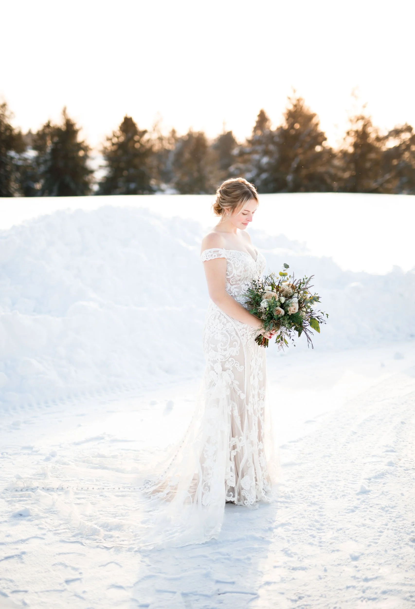 Bride standing in the snow at a Niagara-on-the-Lake winter wedding in Ontario