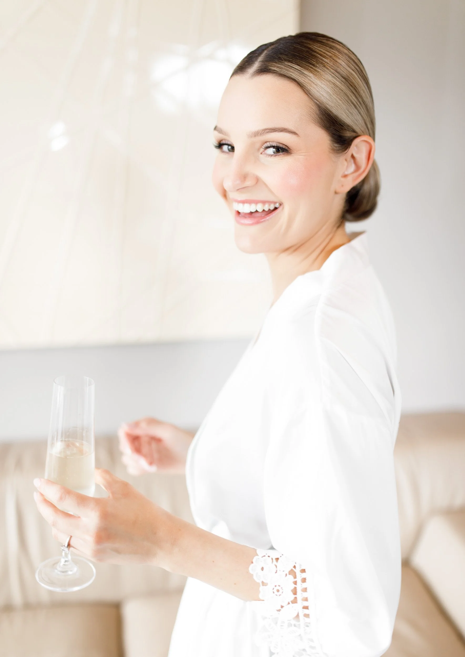Bride in her robe getting ready at The Manor Event Venue in King, Ontario