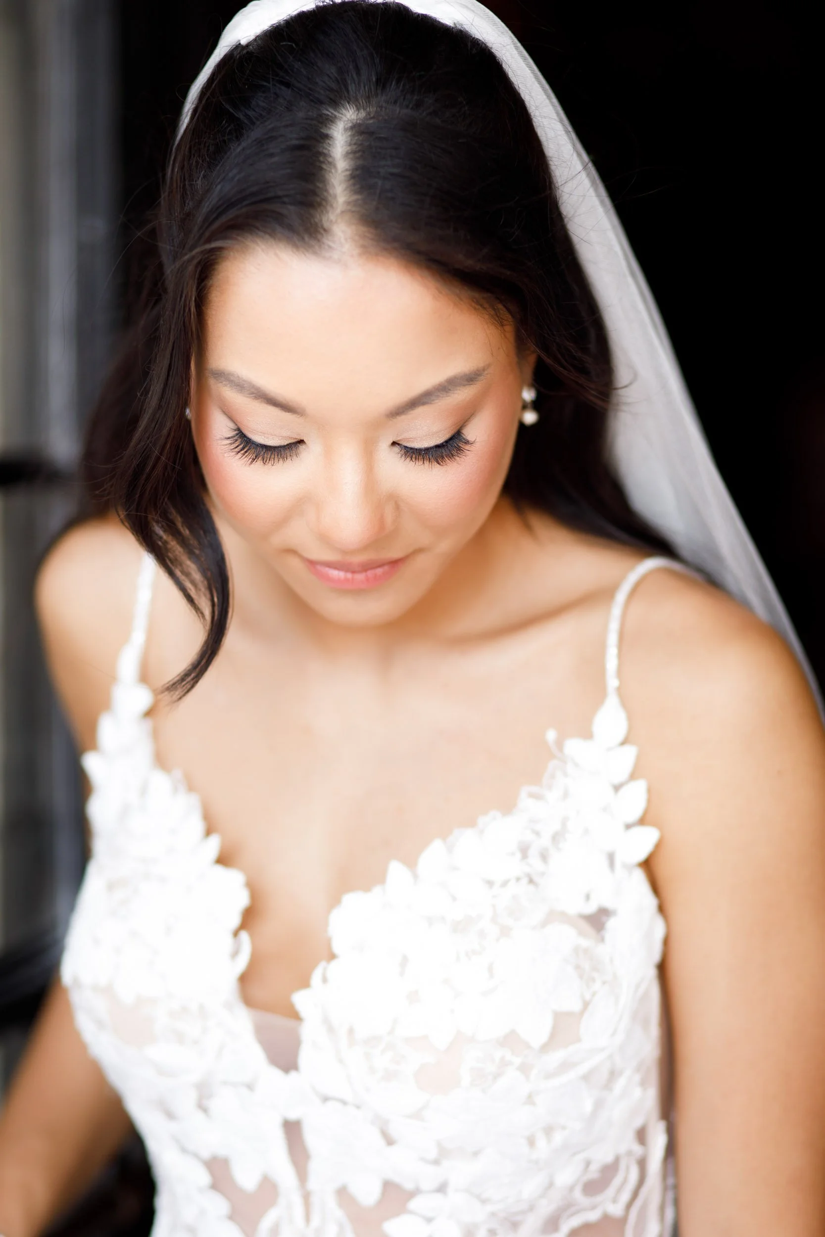 Bride getting ready in her wedding dress at Casa Loma in Toronto