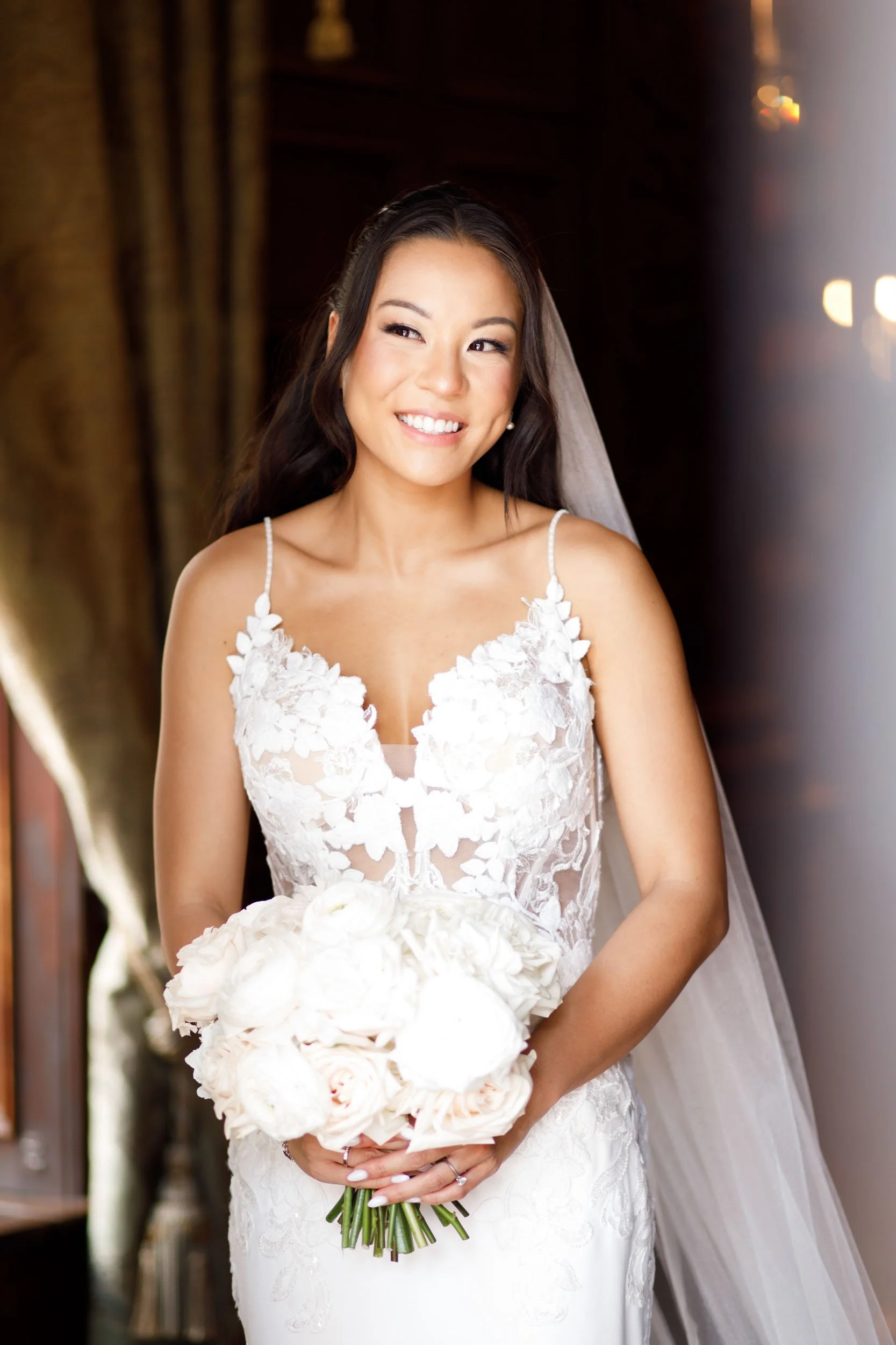 Bride holding her bouquet inside Casa Loma in Toronto