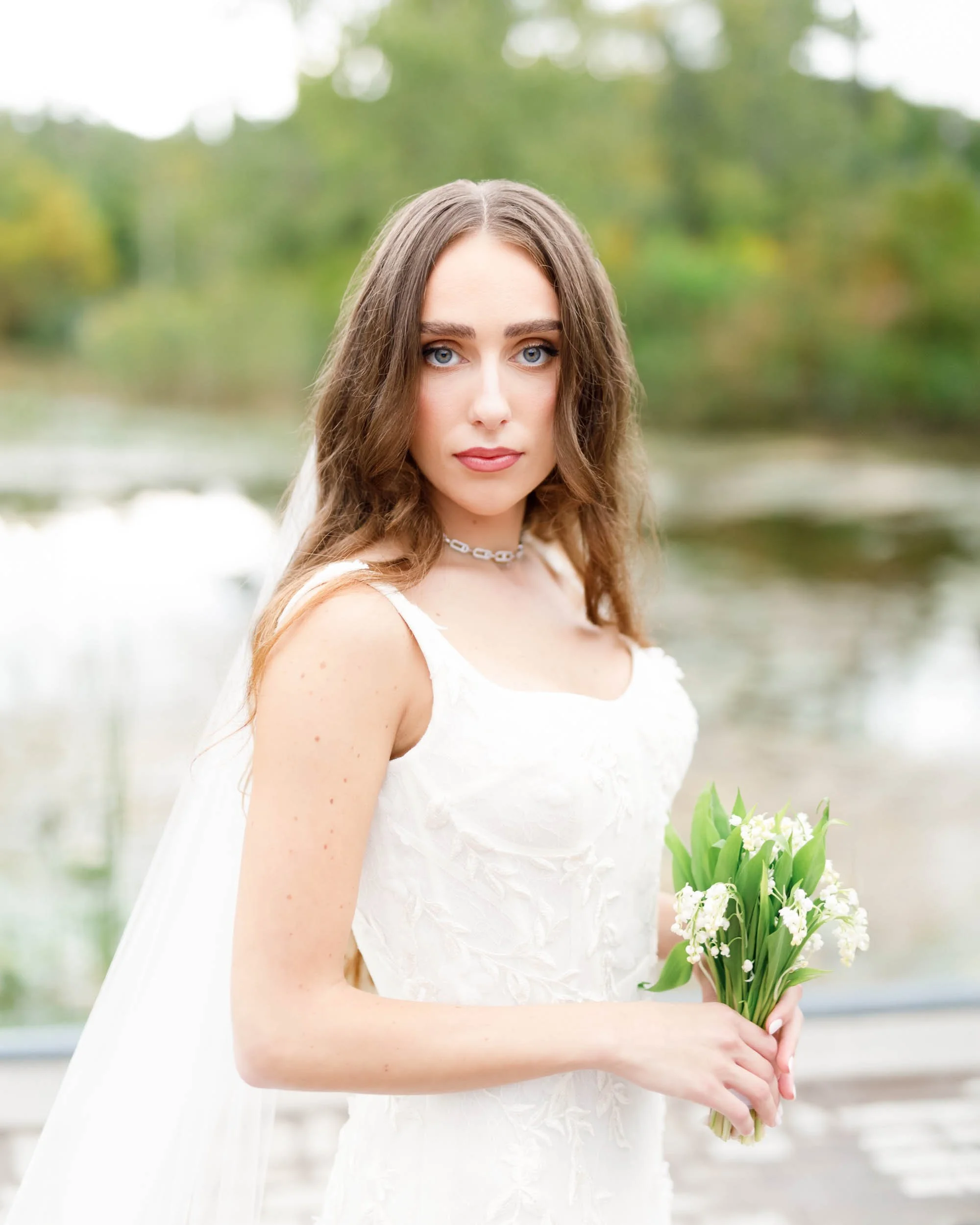 Bride holding flowers at an Evergreen Brick Works wedding in Toronto