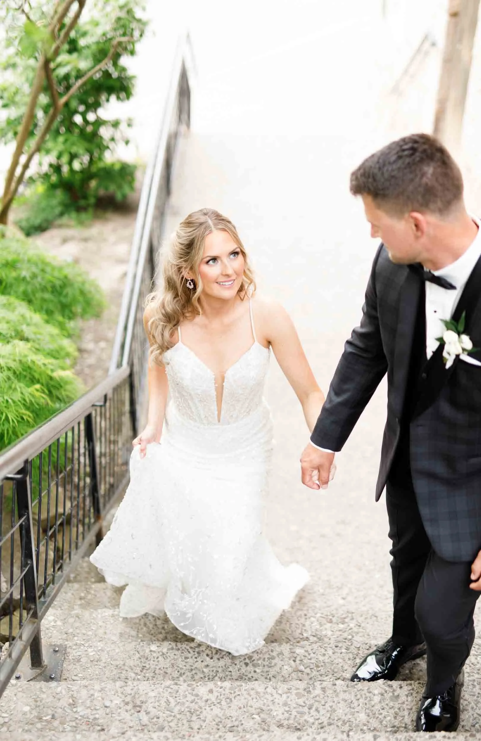 Bride and groom walking together at Ancaster Mill in Ancaster, Ontario