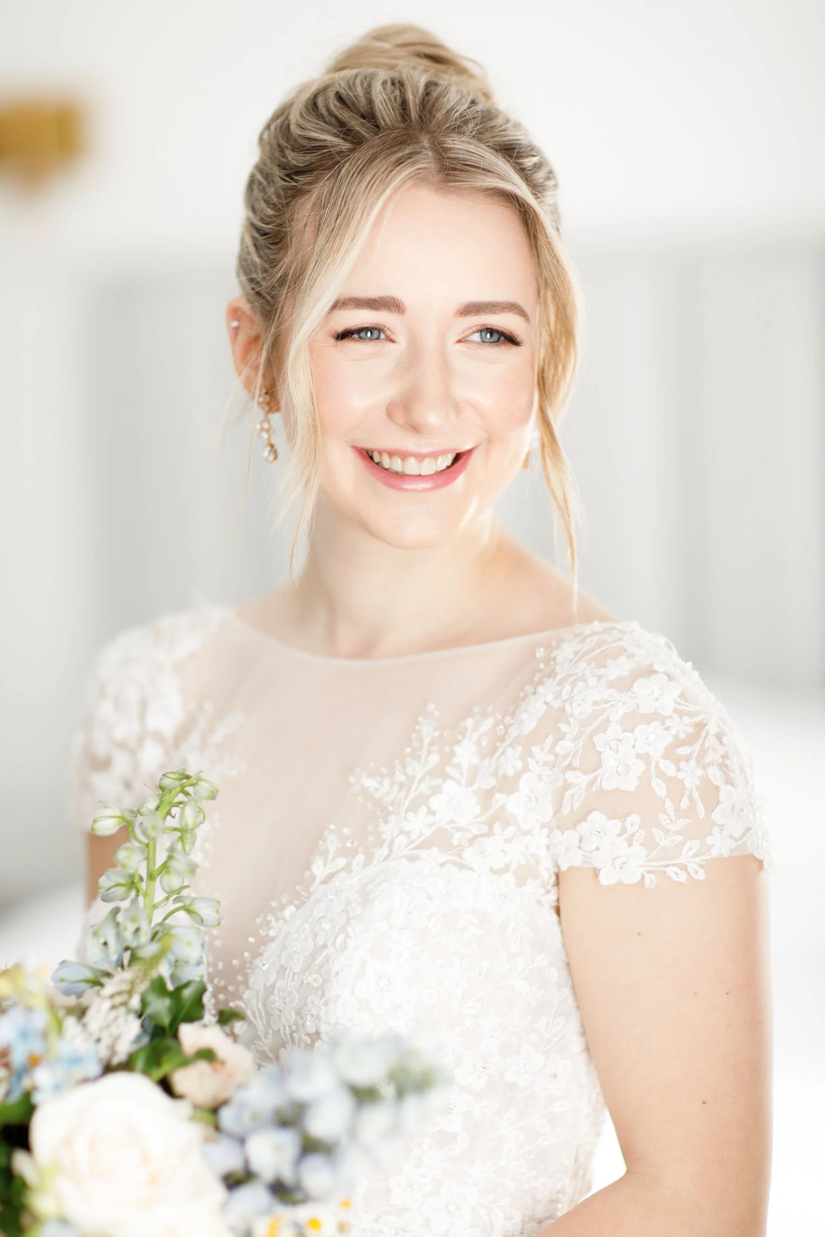 Bride smiling with her bouquet at a Mount Alverno wedding in Caledon Village