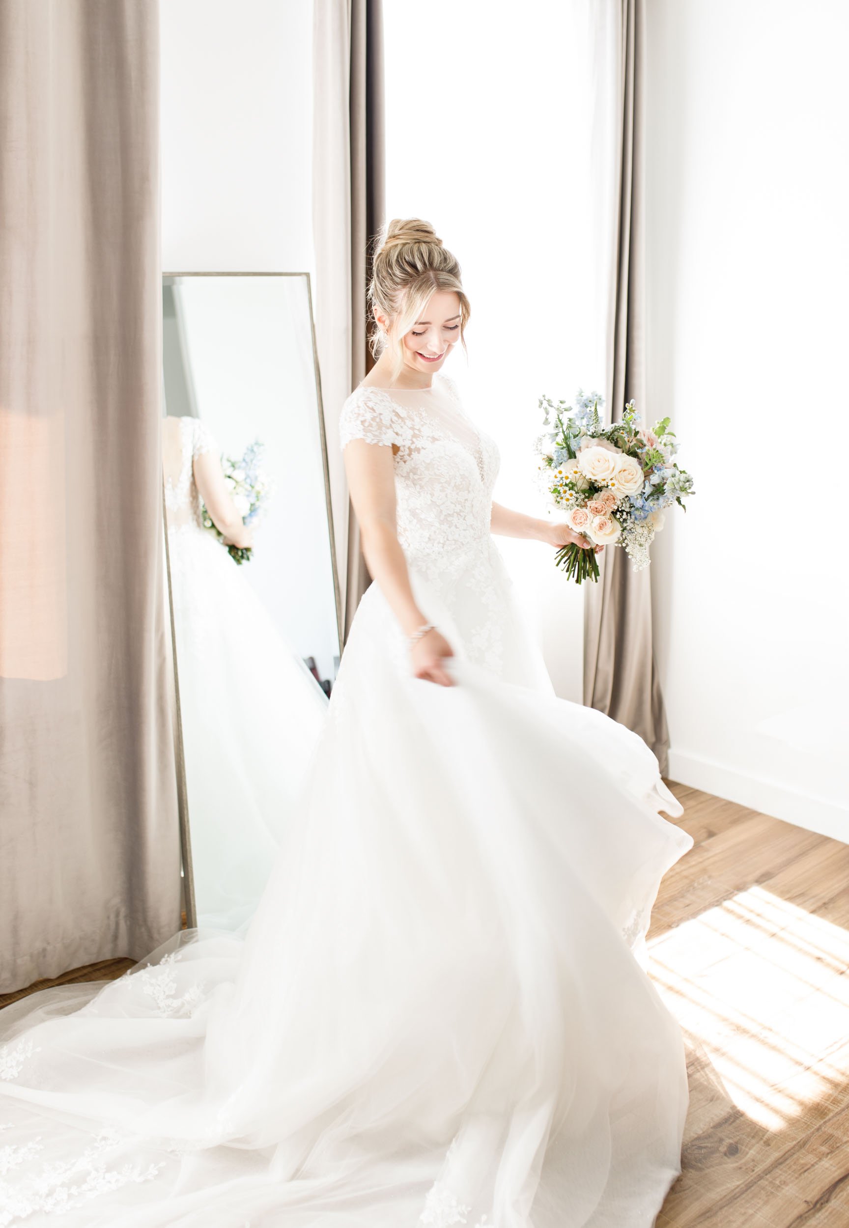 Bride twirling in her wedding dress at Mount Alverno in Caledon Village