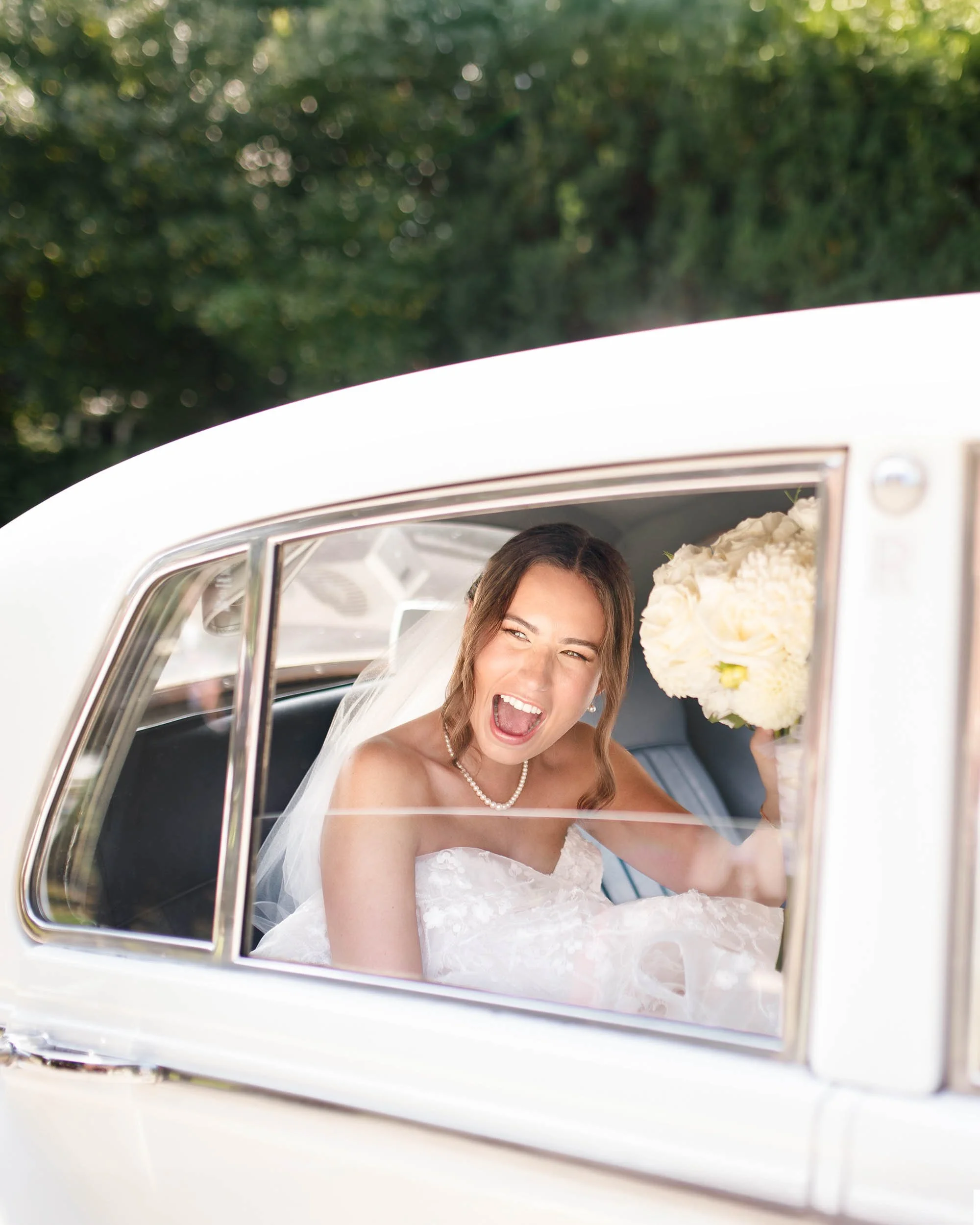 Bride in a vintage car at The Oakville Club wedding in Oakville