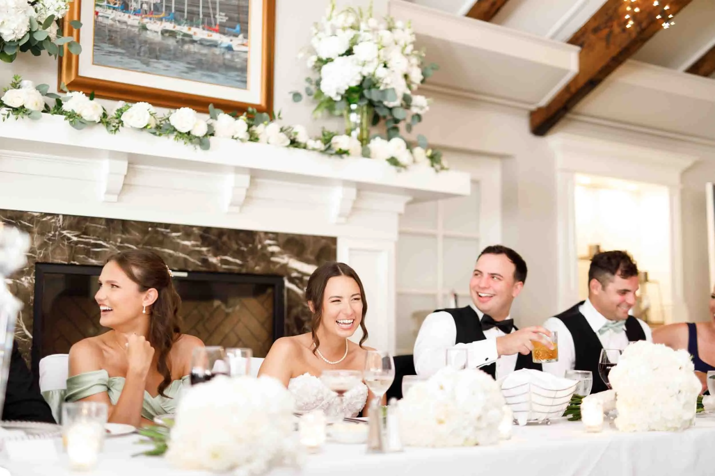 Bride and groom seated at the head table at The Oakville Club in Oakville
