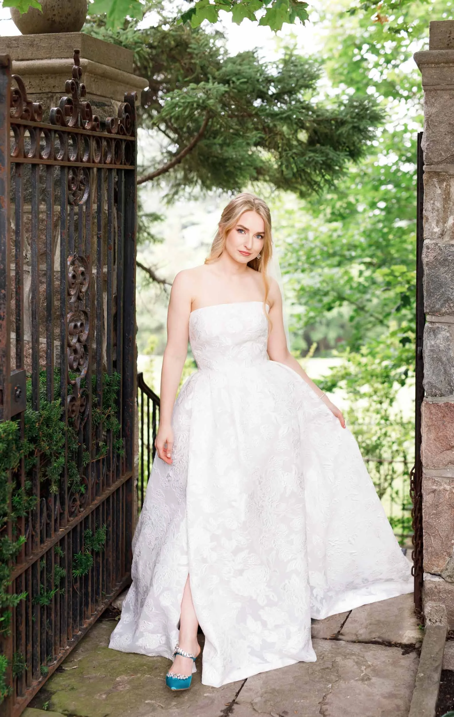 Bride walking through the gardens at Graydon Hall in Toronto
