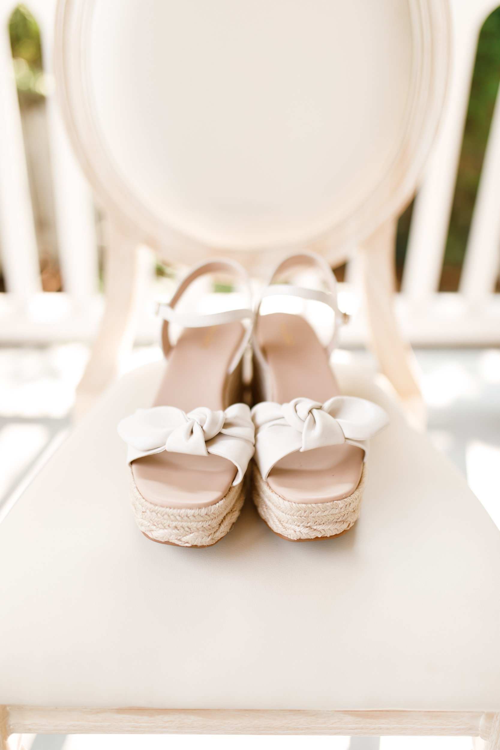 Bride’s wedding shoes on ceremony chair at The Doctor’s House in Kleinburg
