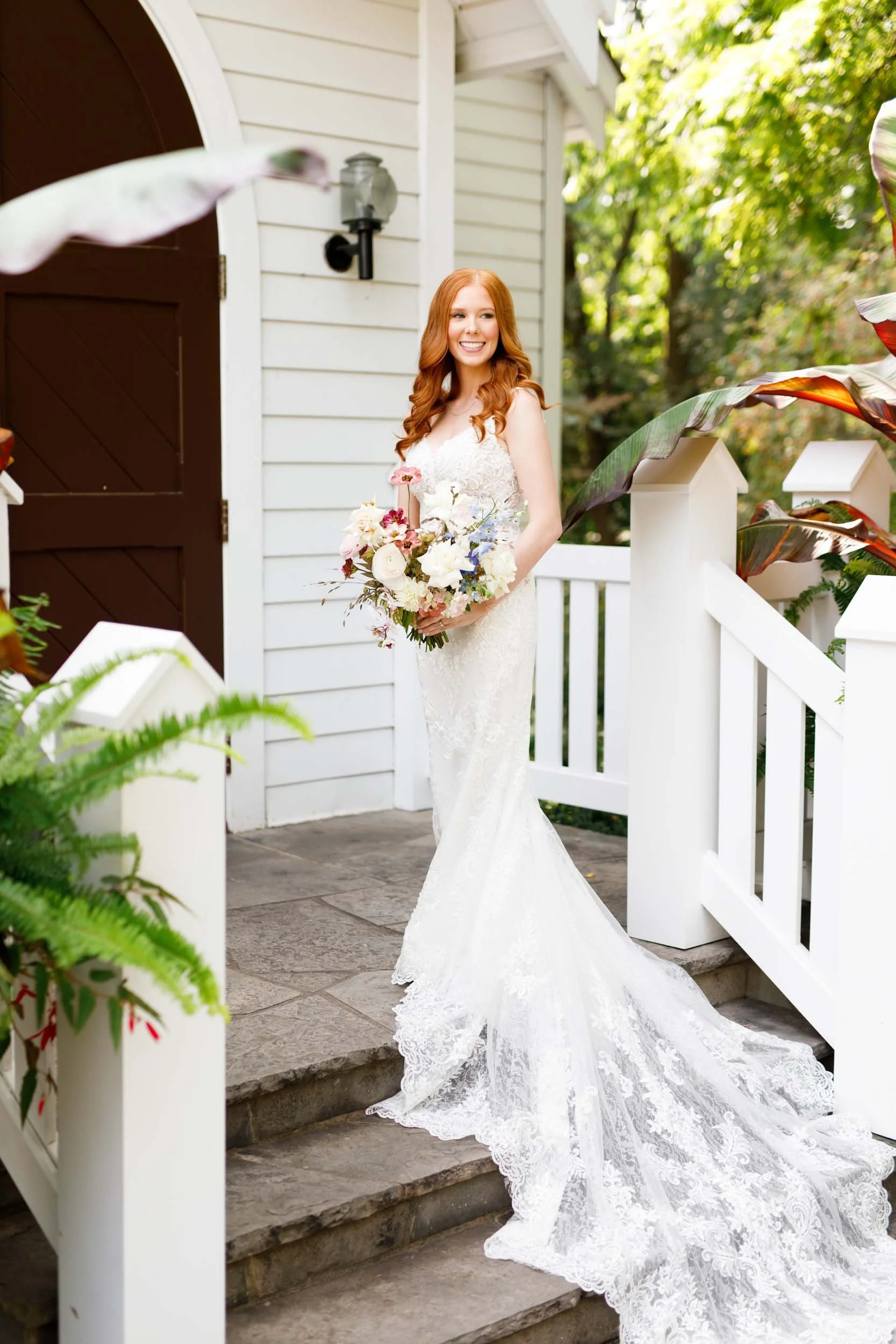 Bride on porch at The Doctor’s House in Kleinburg, Ontario summer wedding