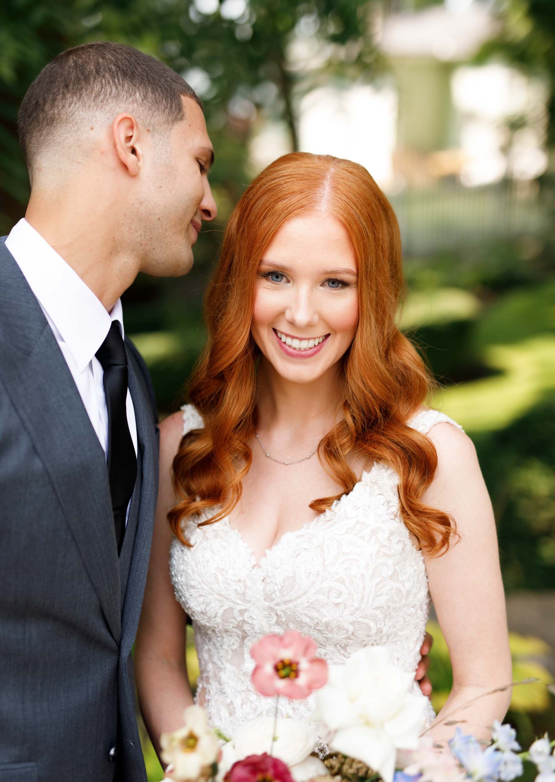 Bride and groom smiling together at The Doctor’s House in Kleinburg, Ontario