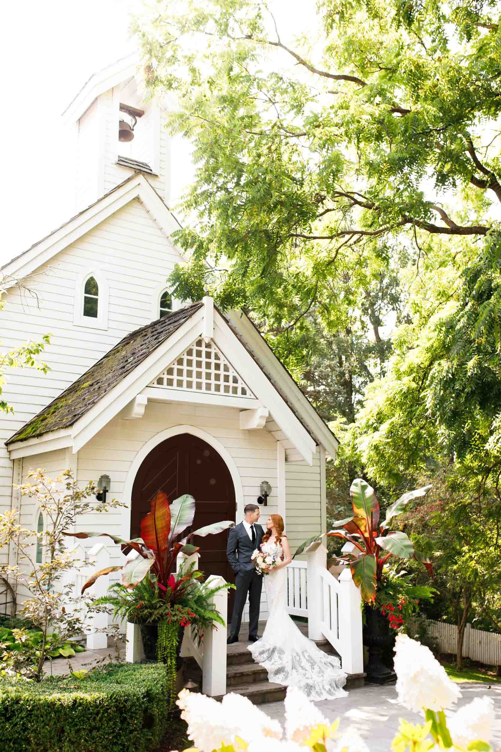 Bride and Groom at wedding chapel exterior at The Doctor’s House in Kleinburg, Ontario