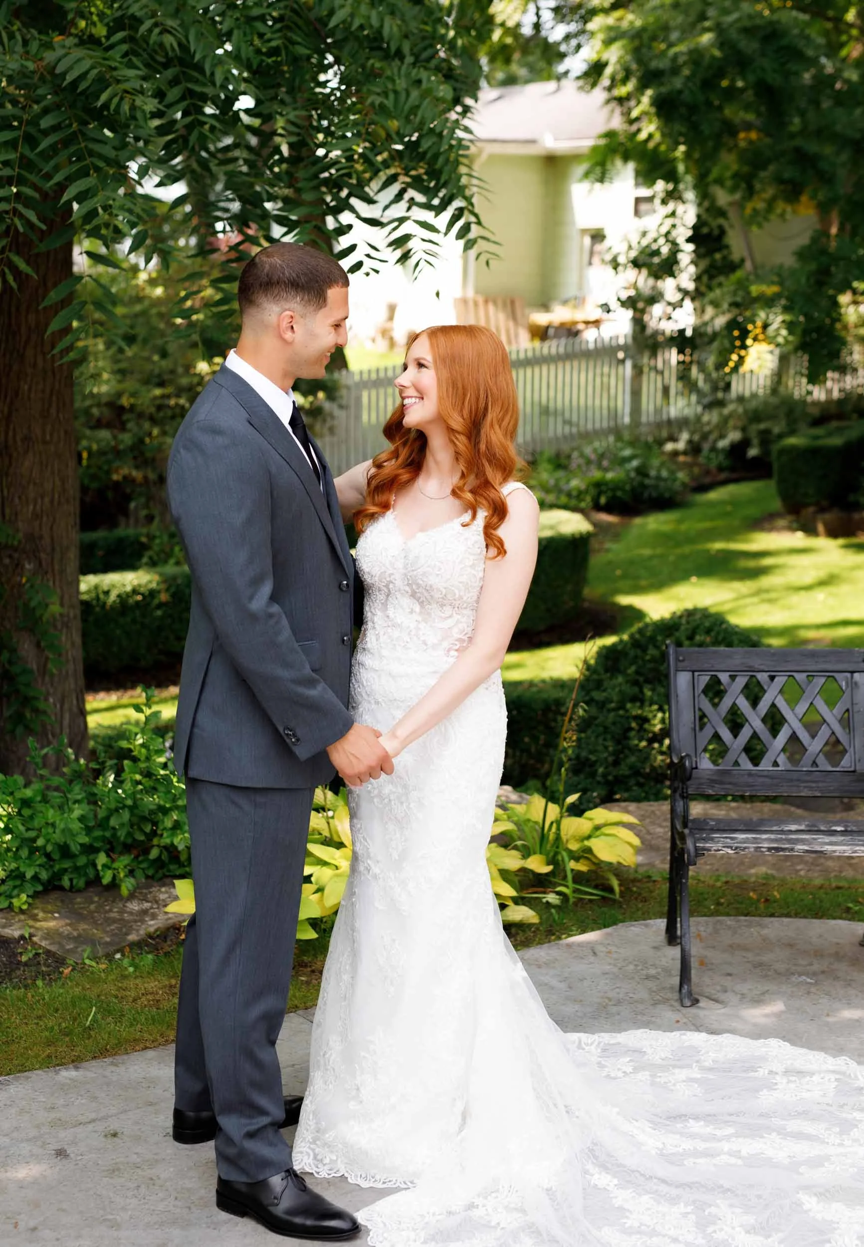 Bride and groom standing in garden at The Doctor’s House in Kleinburg, Ontario