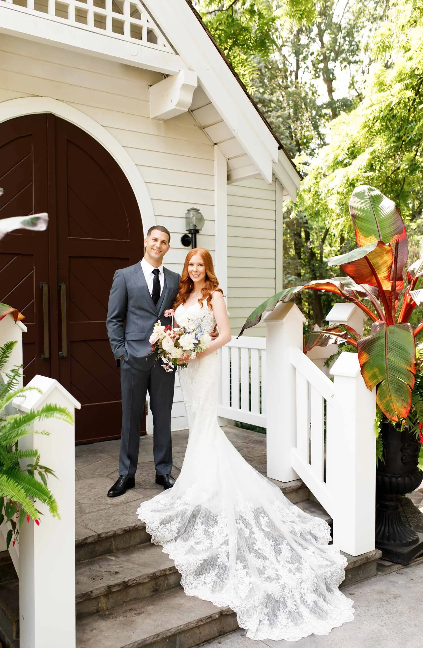 Bride and groom standing on chapel steps at The Doctor’s House in Kleinburg wedding