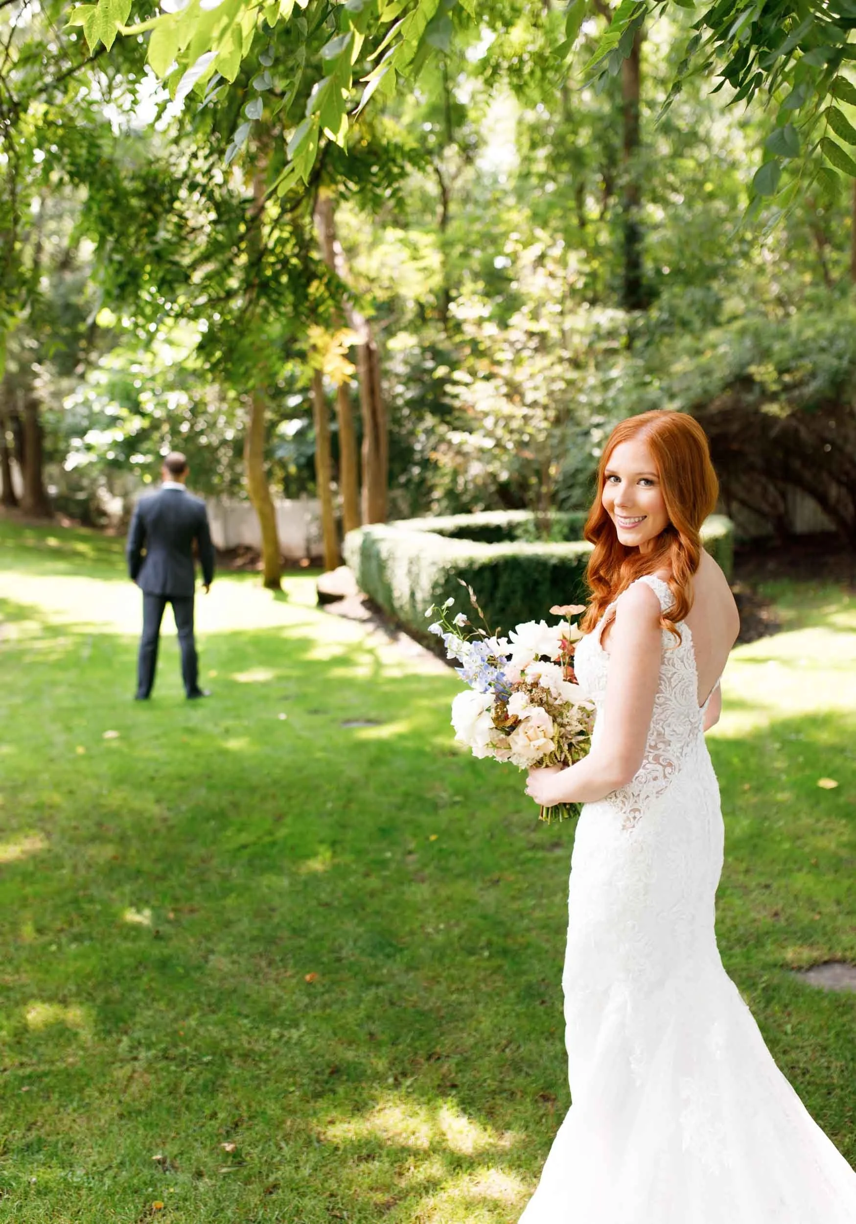 Bride walking toward groom for first look at The Doctor’s House in Kleinburg wedding