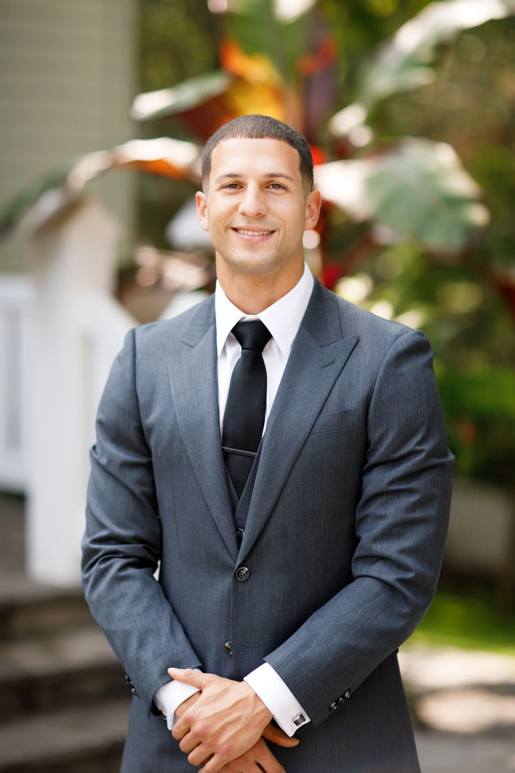 Groom portrait in garden at The Doctor’s House in Kleinburg, Ontario wedding