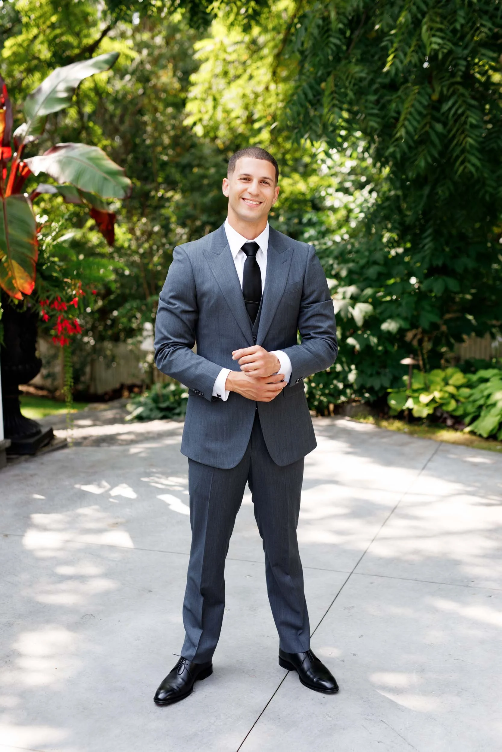 Groom standing outdoors at The Doctor’s House in Kleinburg, Ontario wedding