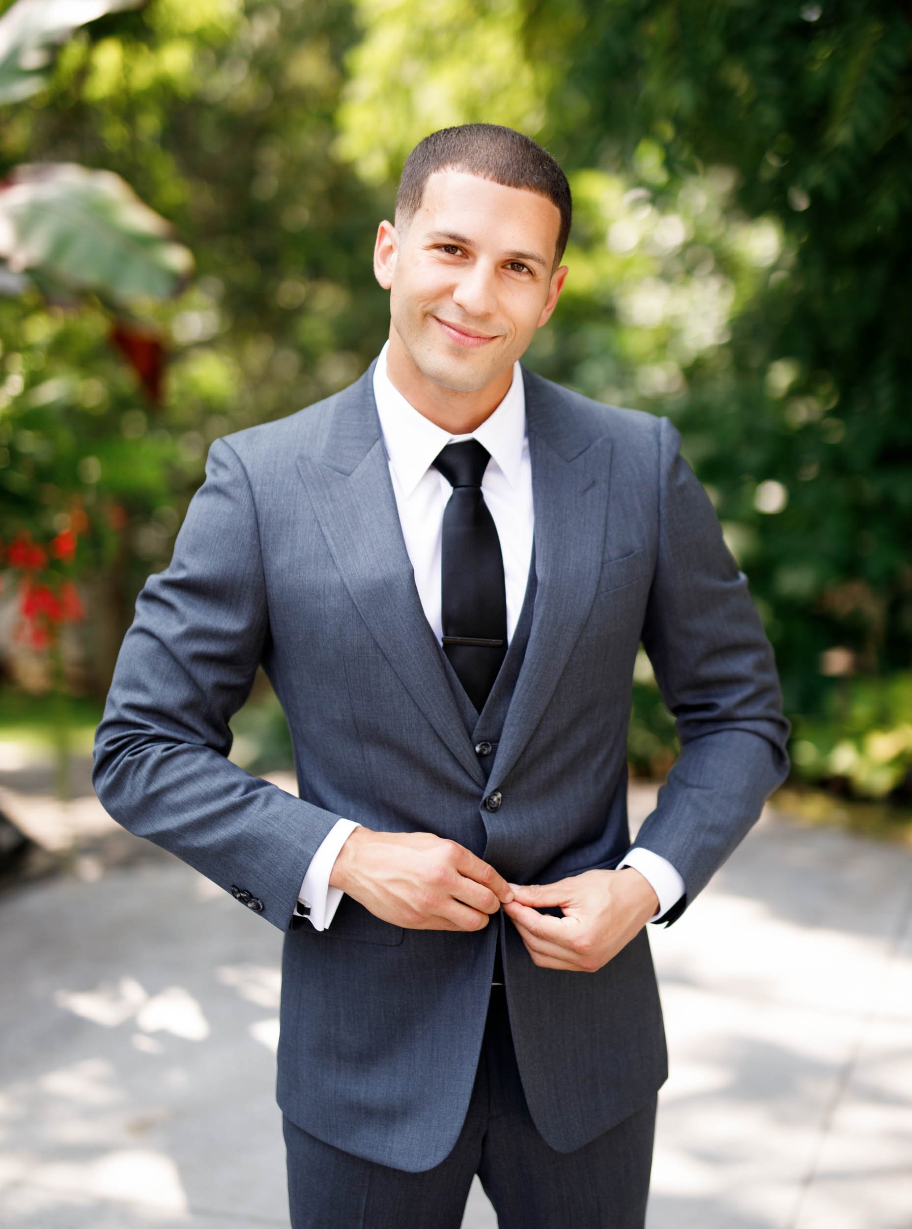 Groom adjusting suit jacket at The Doctor’s House in Kleinburg, Ontario