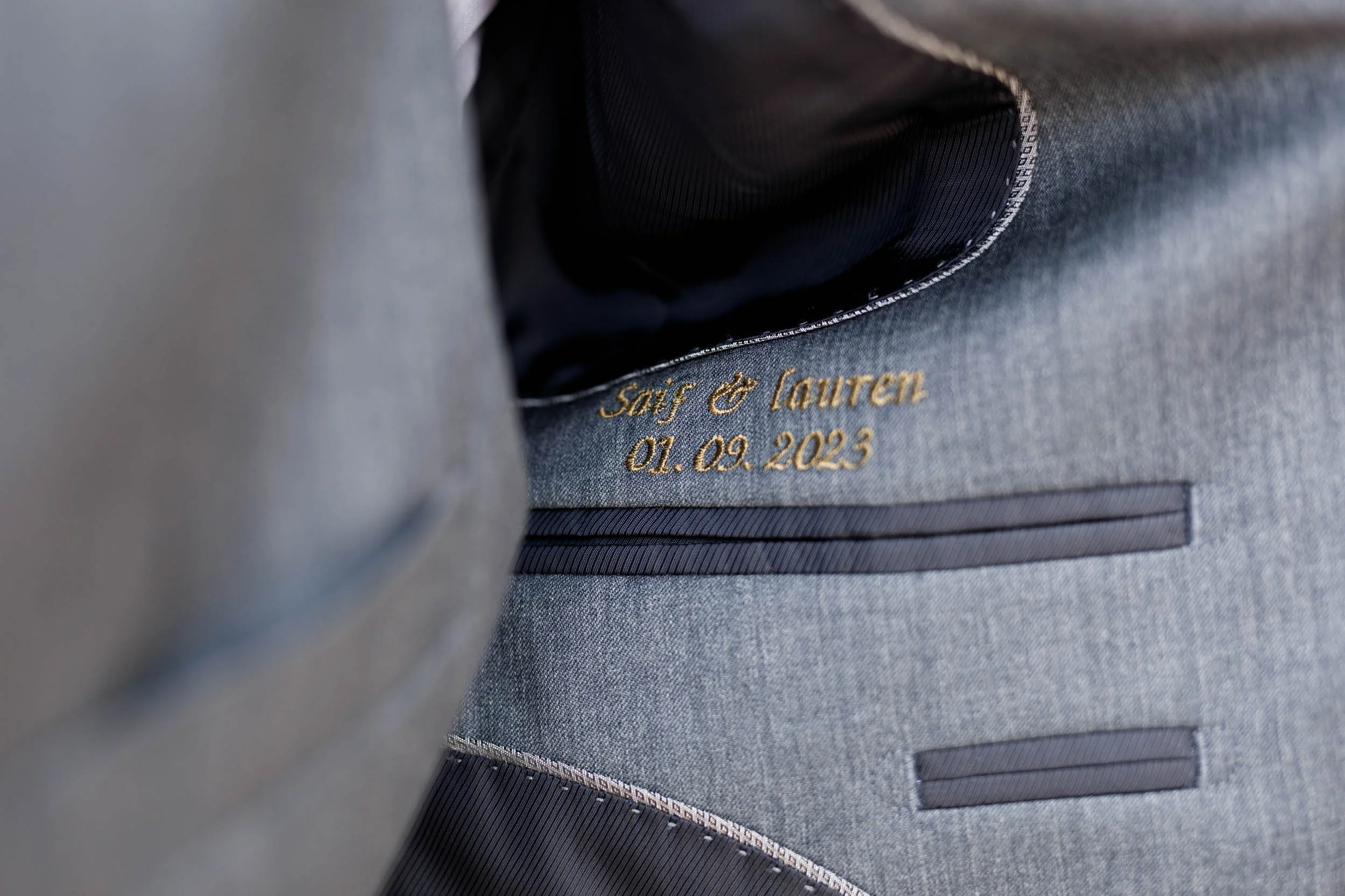 Groom jacket detail during wedding at The Doctor’s House in Kleinburg, Ontario