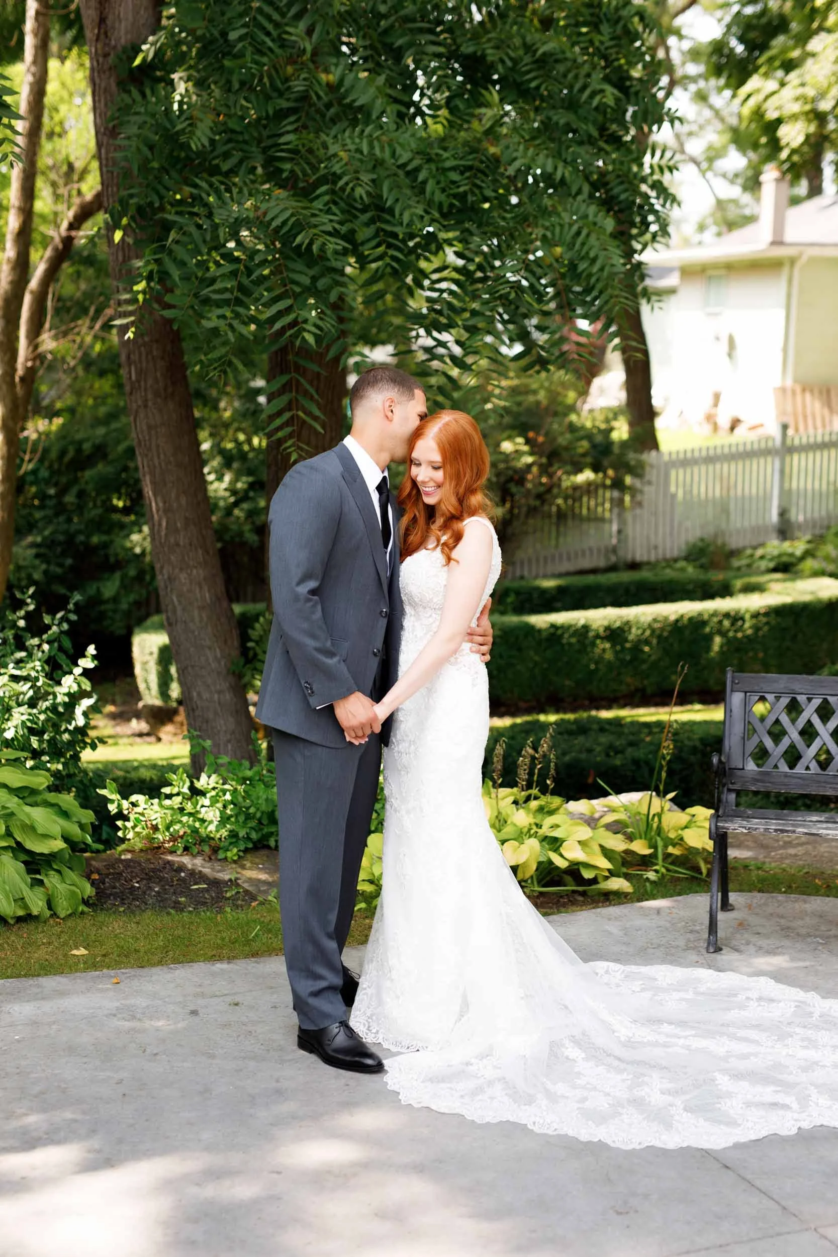 Bride and groom sharing a kiss at The Doctor’s House in Kleinburg, Ontario
