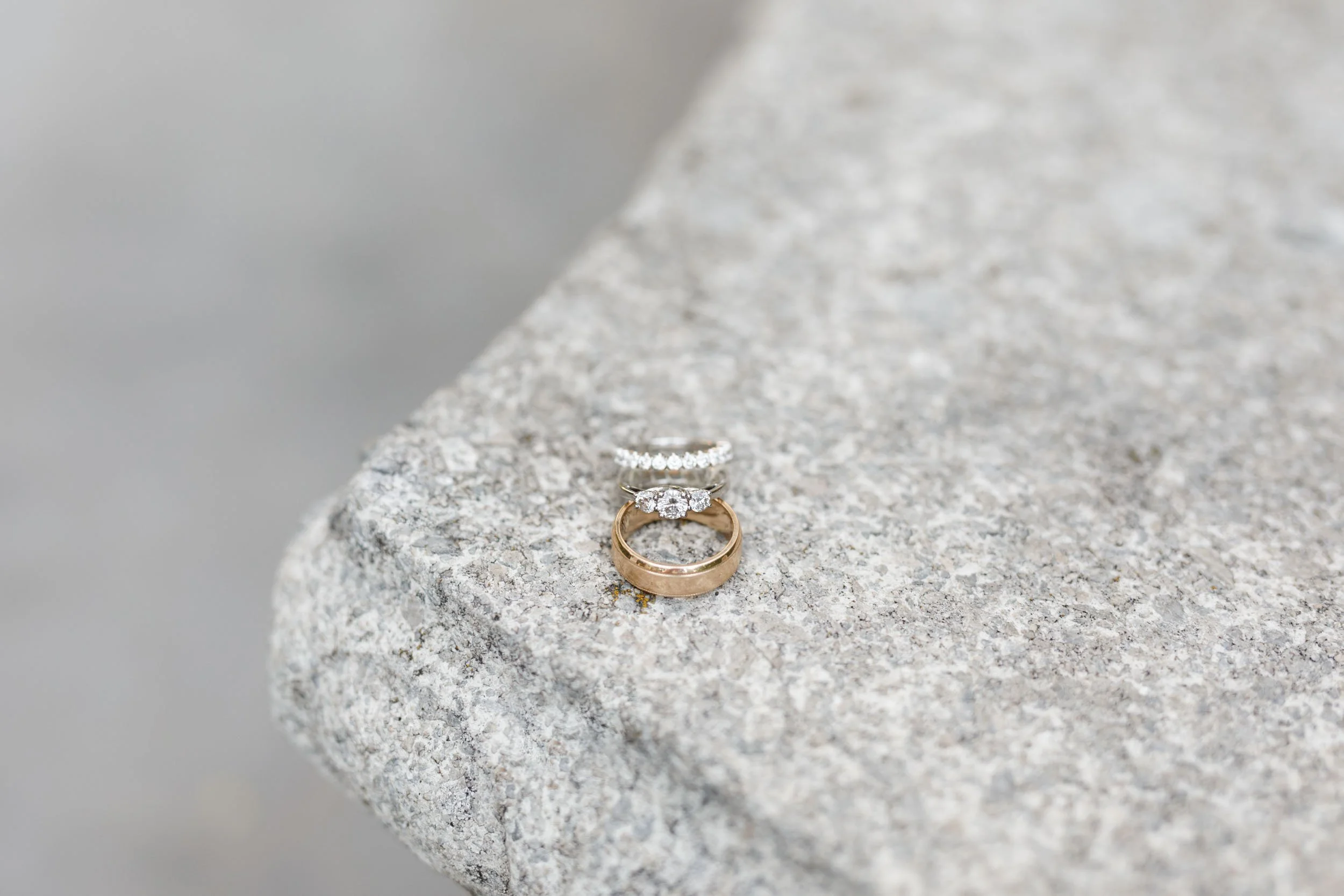 Wedding rings on stone ledge at The Doctor’s House in Kleinburg, Ontario