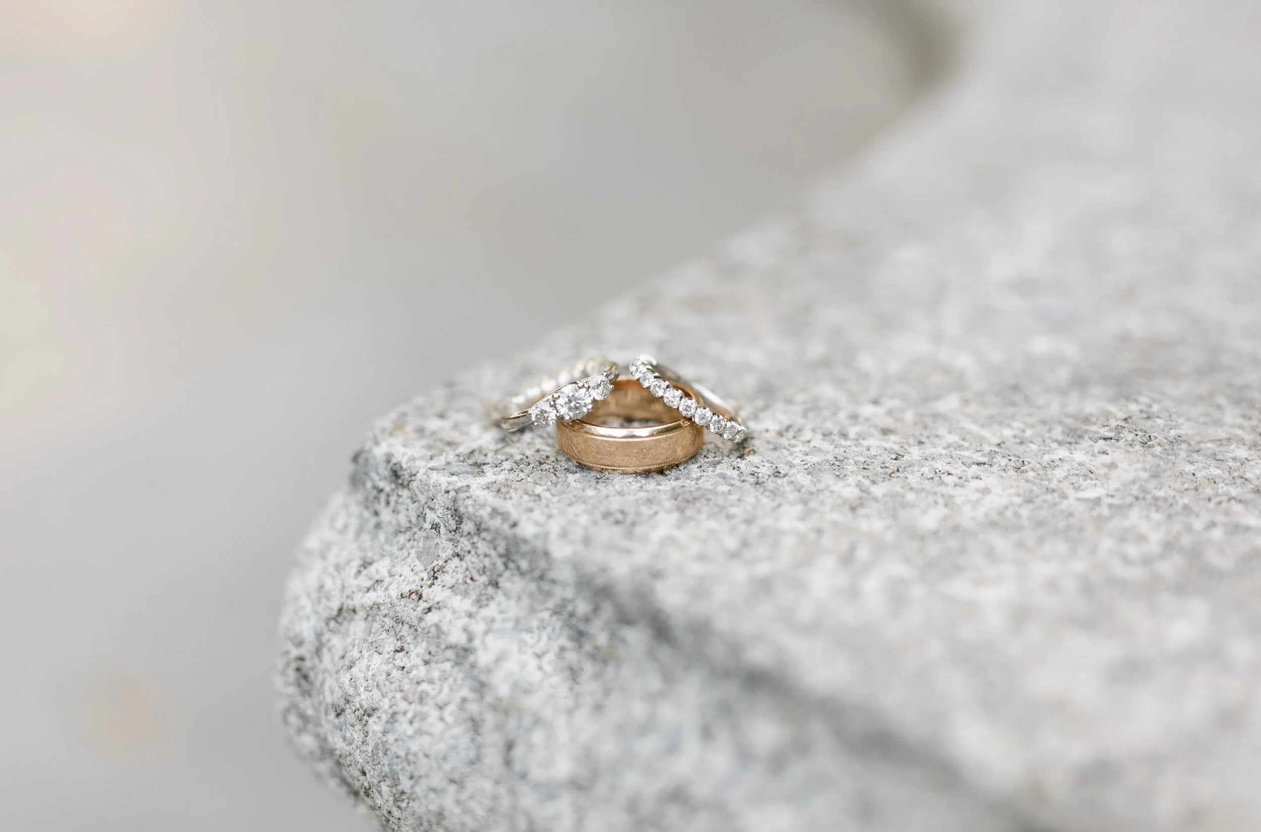 Macro wedding ring detail on stone at The Doctor’s House in Kleinburg, Ontario