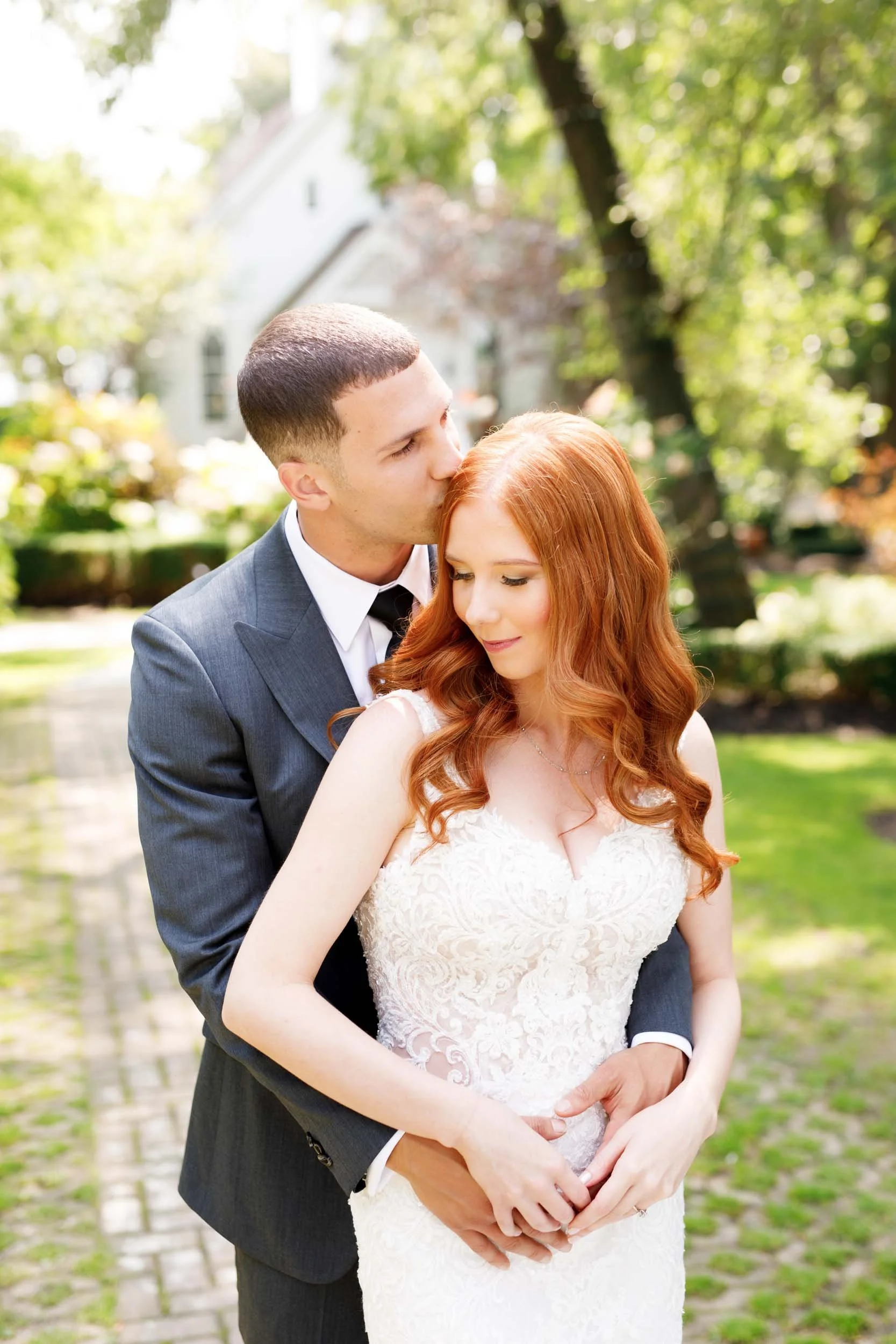 Bride and groom embracing outdoors at The Doctor’s House in Kleinburg wedding