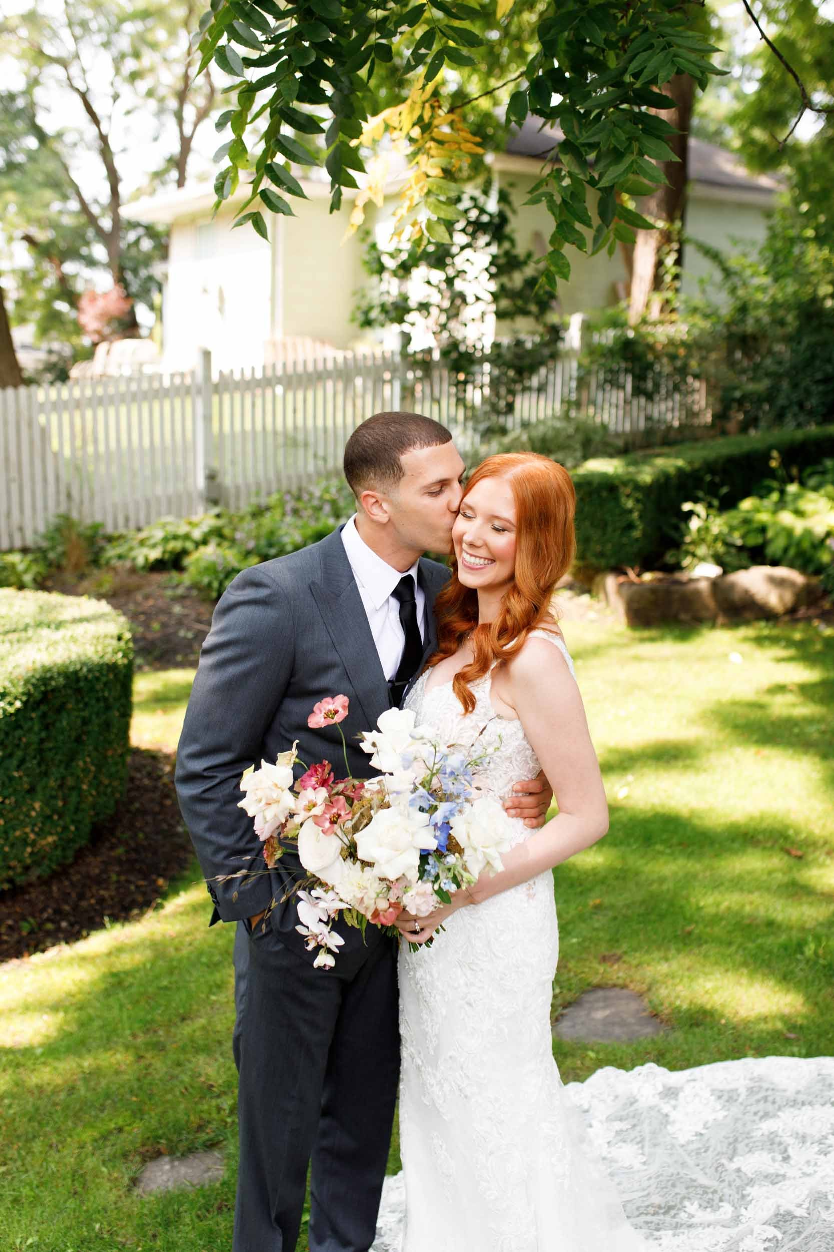 Bride and groom sharing a kiss at The Doctor’s House in Kleinburg, Ontario wedding