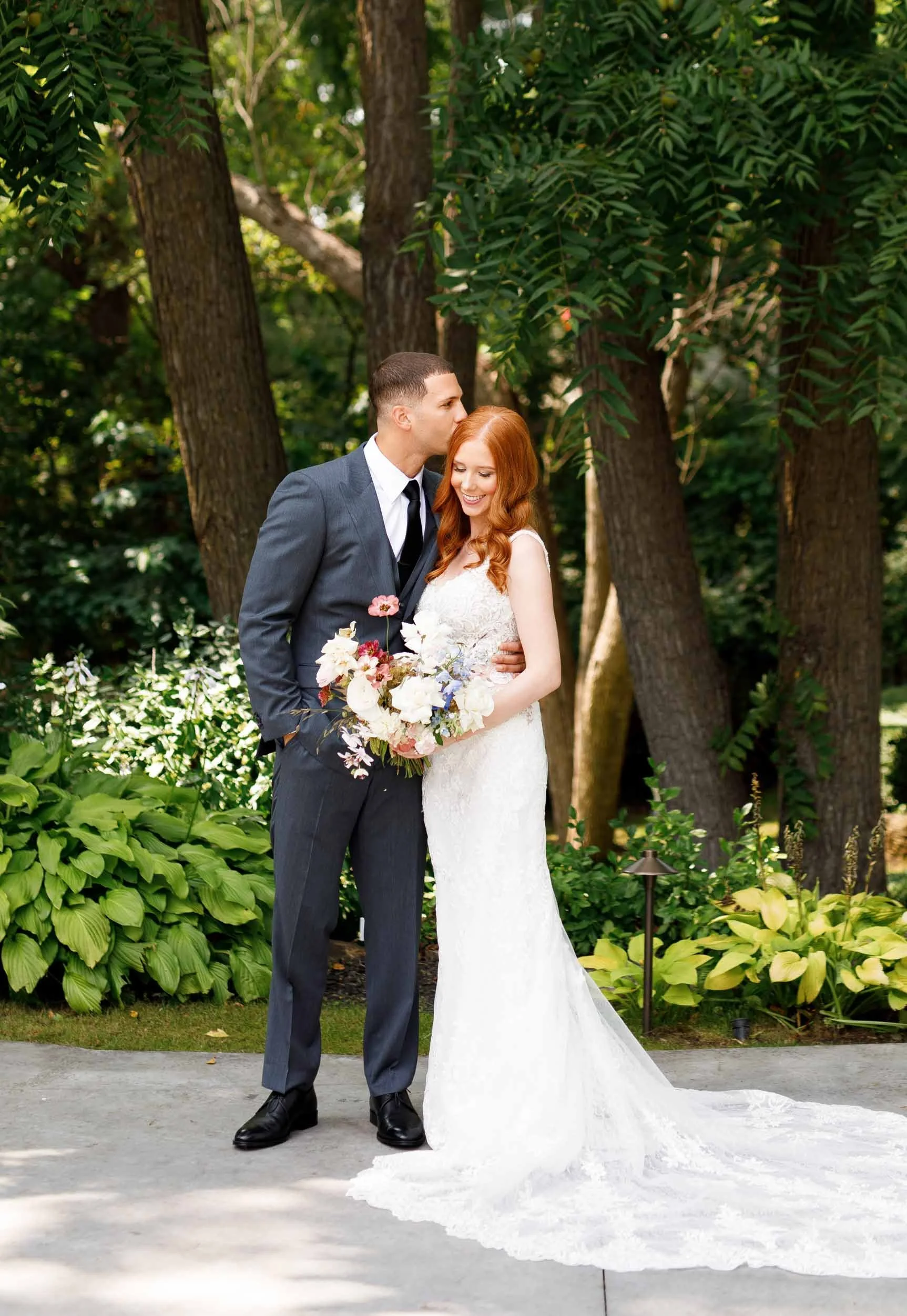 Bride and groom standing in garden at The Doctor’s House in Kleinburg, Ontario