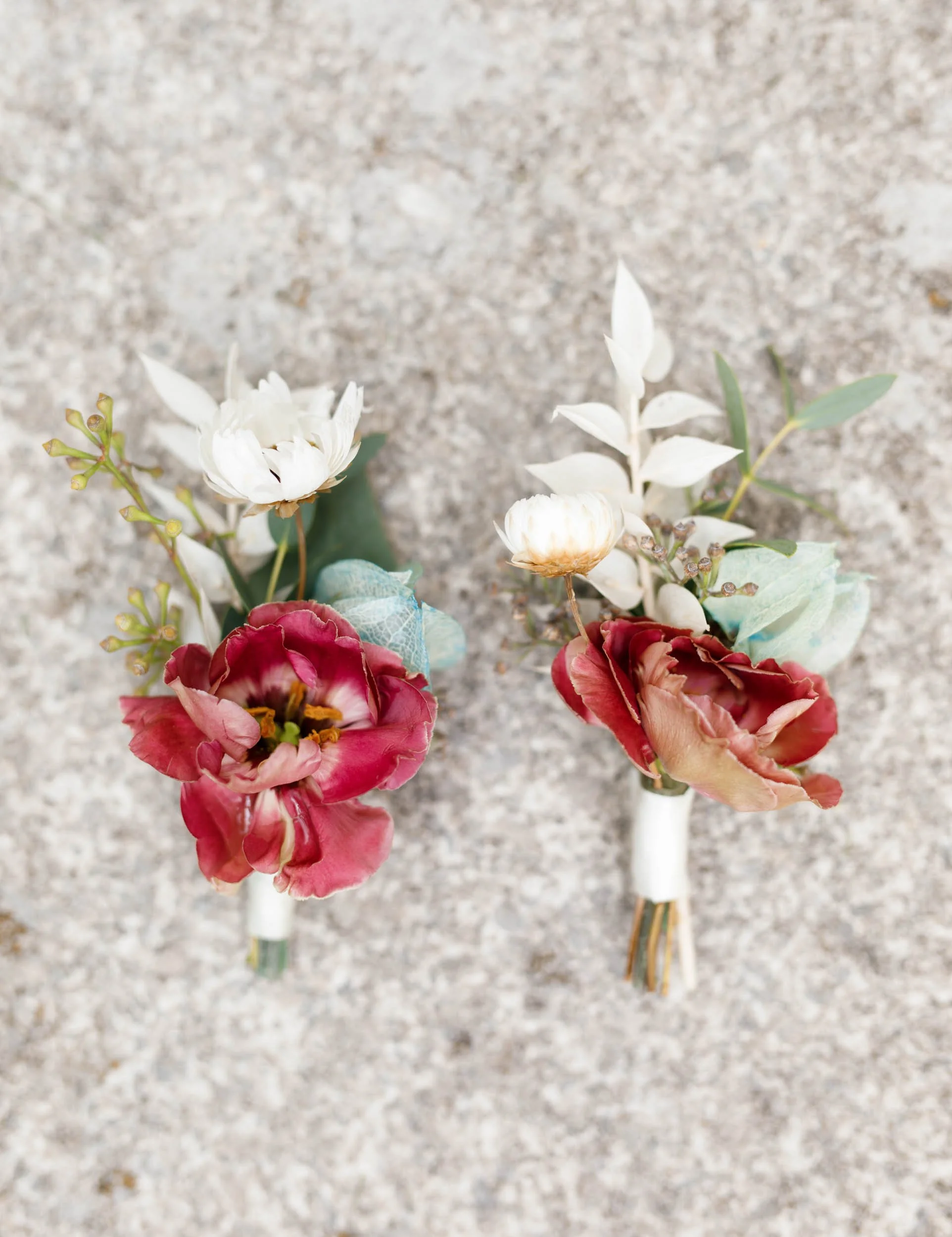 Summer wedding boutonnieres on stone at The Doctor’s House in Kleinburg, Ontario