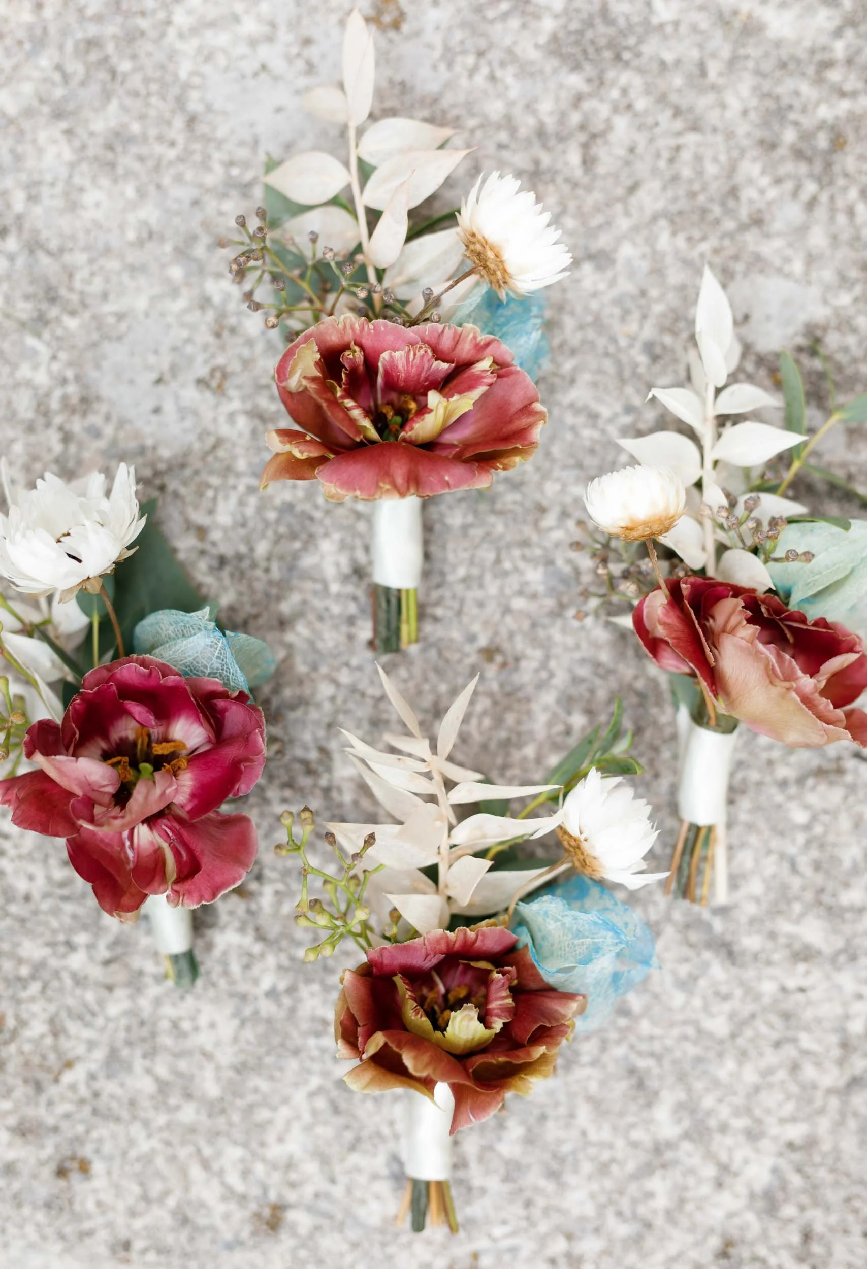 Wedding boutonnieres flat lay on stone at The Doctor’s House, Kleinburg Ontario